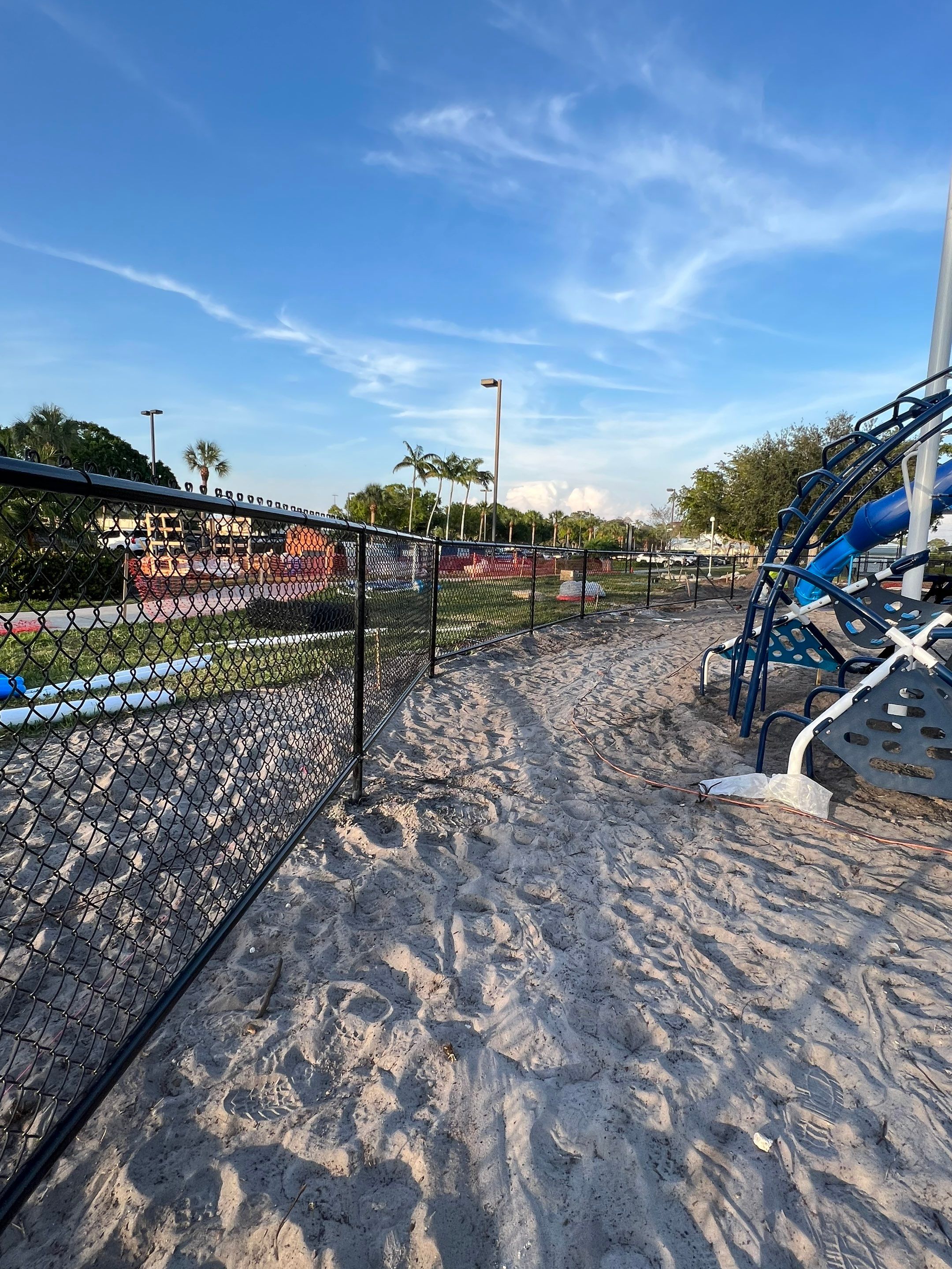 Vinyl Coated Chain-link fence for the City of Naples around Fleischmann Park Playground.  by Asap fence and gates, LLC