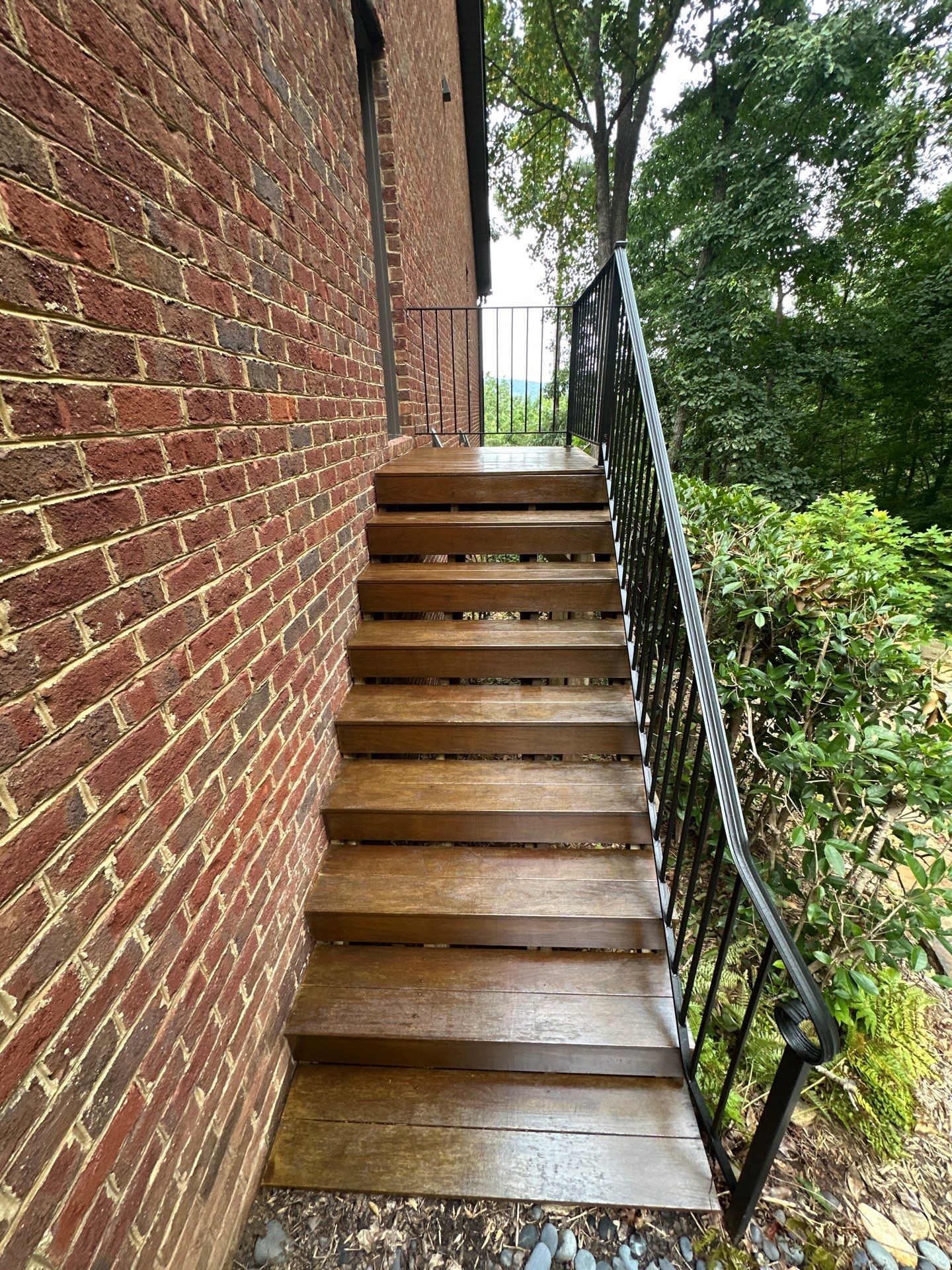 Wood Deck Refinishing and Black Metal Railing Upgrade in Travelers Rest by Painter1