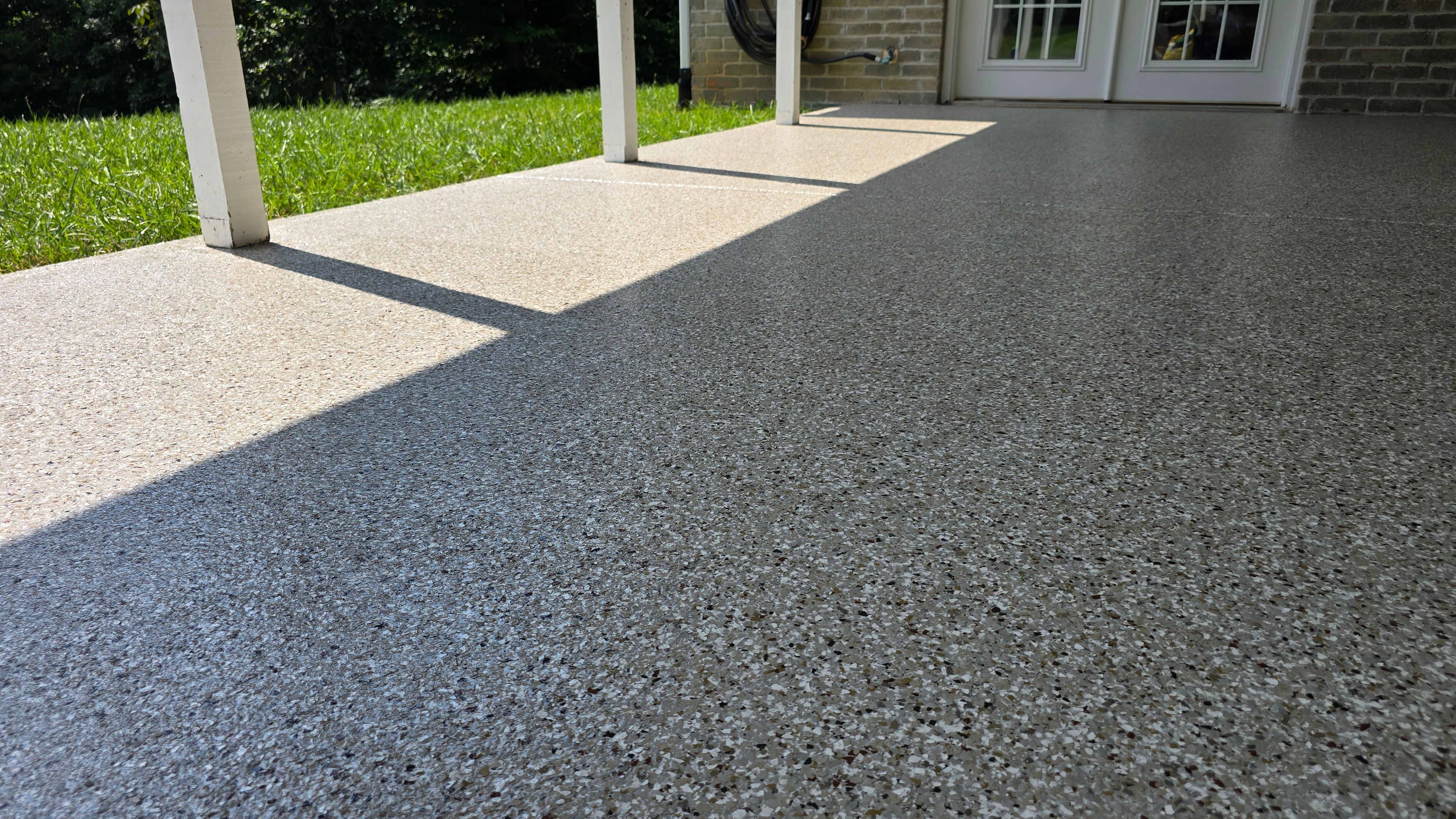Back Patio using Creekbed by Elite Floor Solutions