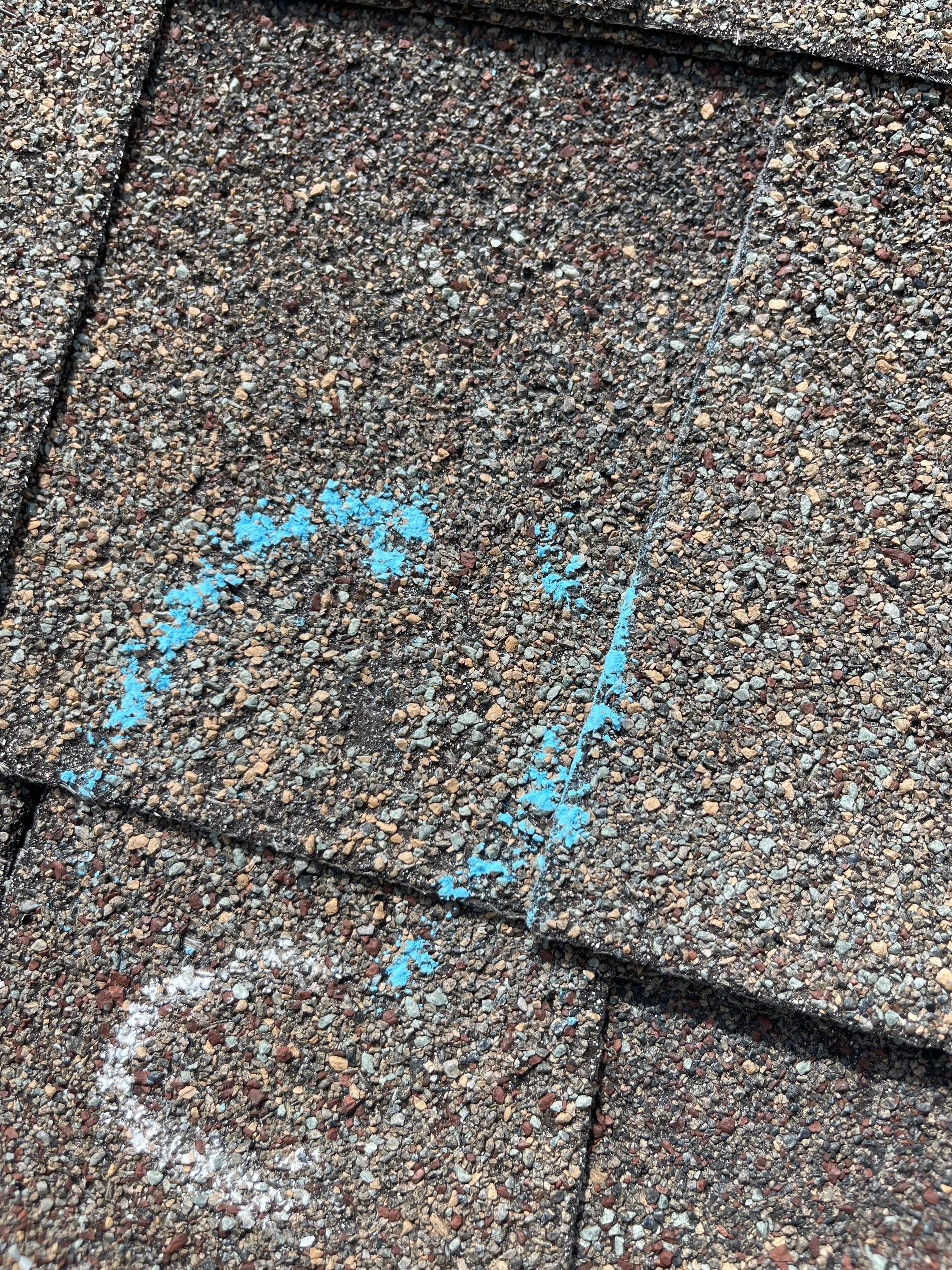 Hail Damage on a Roofing System by Icon Roofing And Construction 