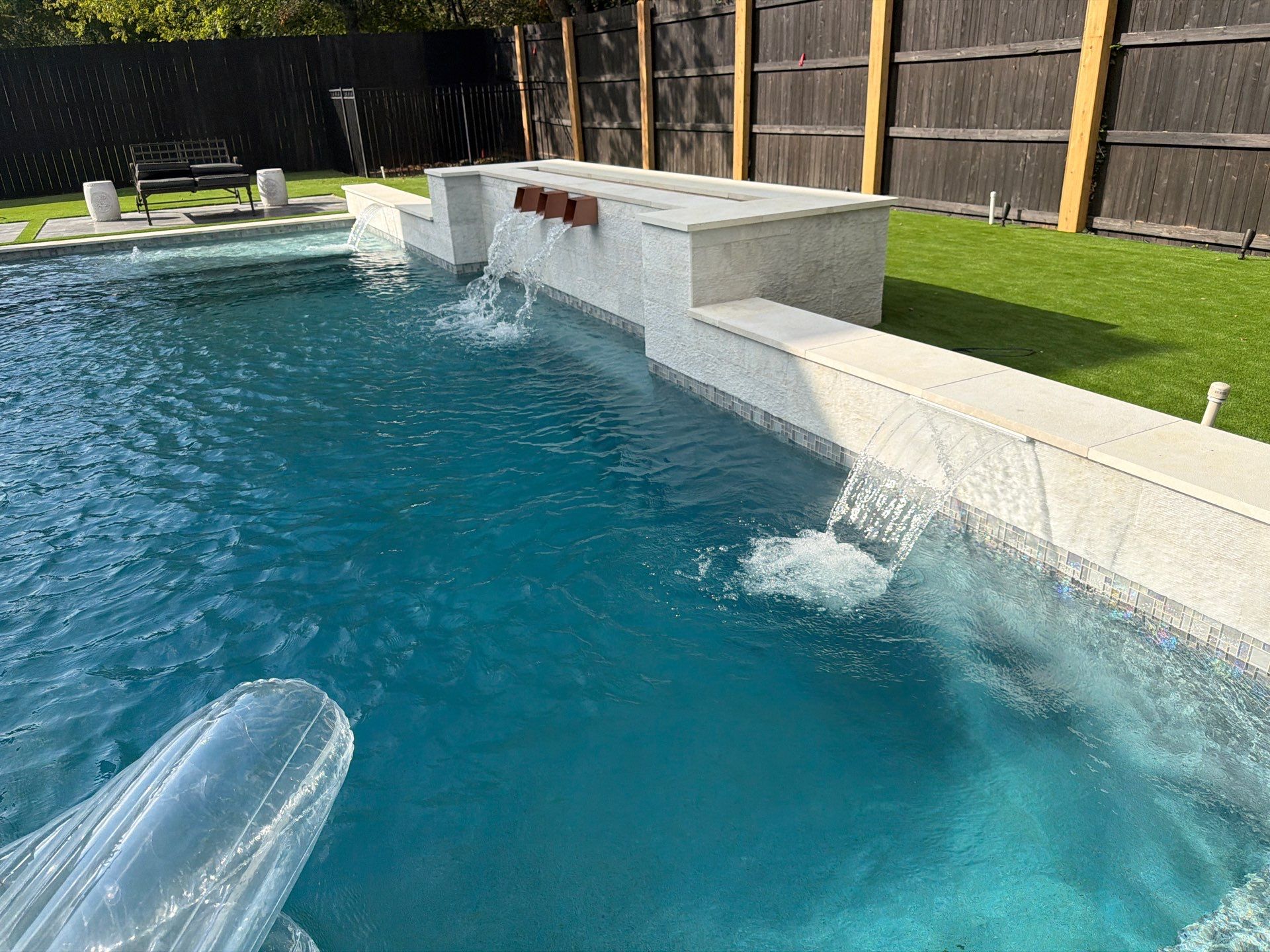 Modern Geometric Pool with Raised Spa and Sheer Descents by Pinnacle Pools and Spas - DFW
