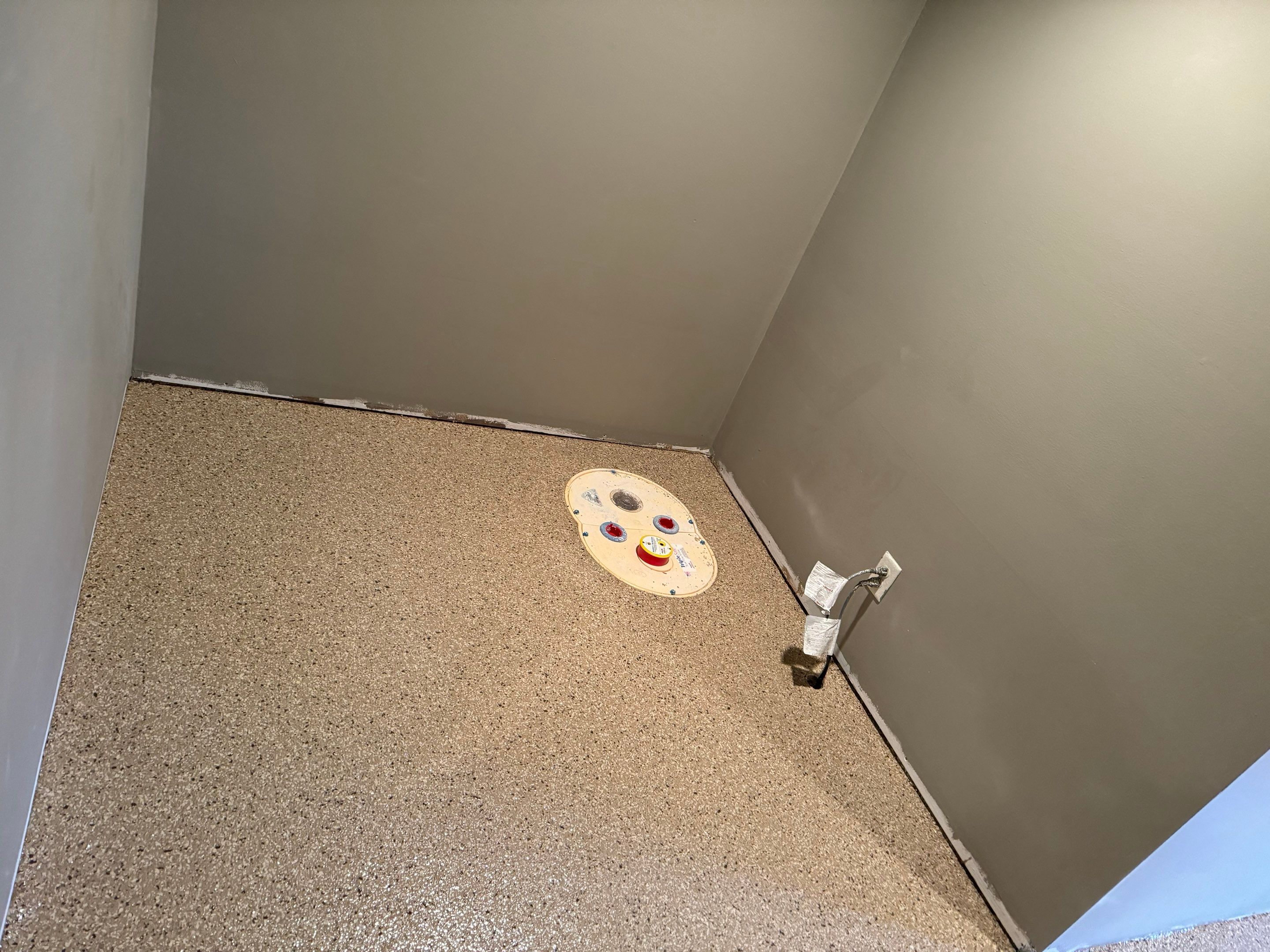 Custom Multi-Fleck Epoxy Floor Coating for Residential Basement by Select Painting, Coatings & Garage Cabinets