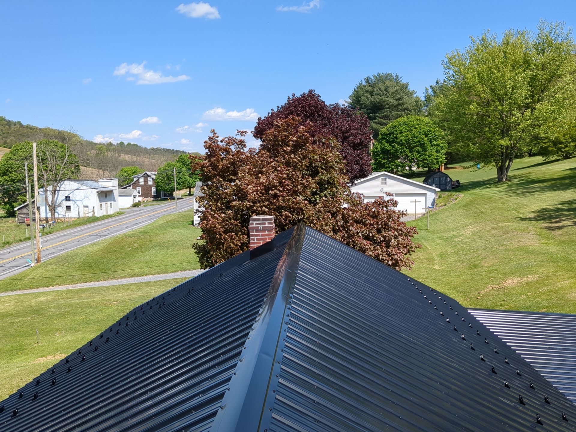 Black ABM Metal Roof Replacement  by Esh Builders
