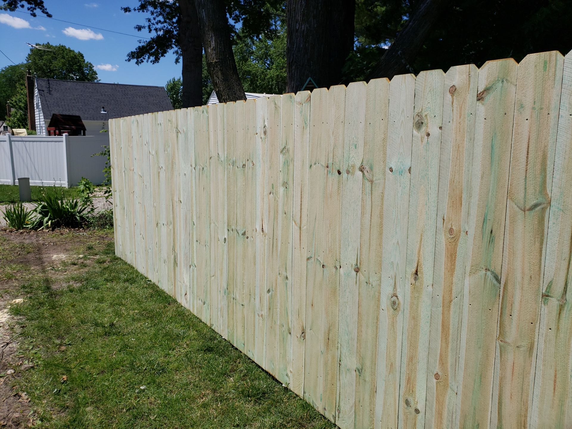 Pressure-Treated Pine Privacy Fence Replacement in Waterloo, Iowa by Perfect Picket Fence and Stain