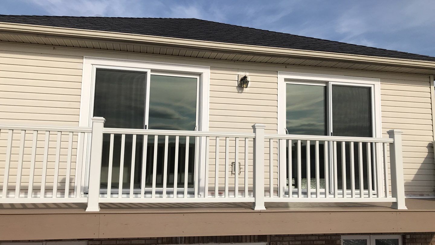 Deck Refurbush and Door Replacement using Trex Decking and Railing. Polaris Patio Doors by Secure Construction Company Inc