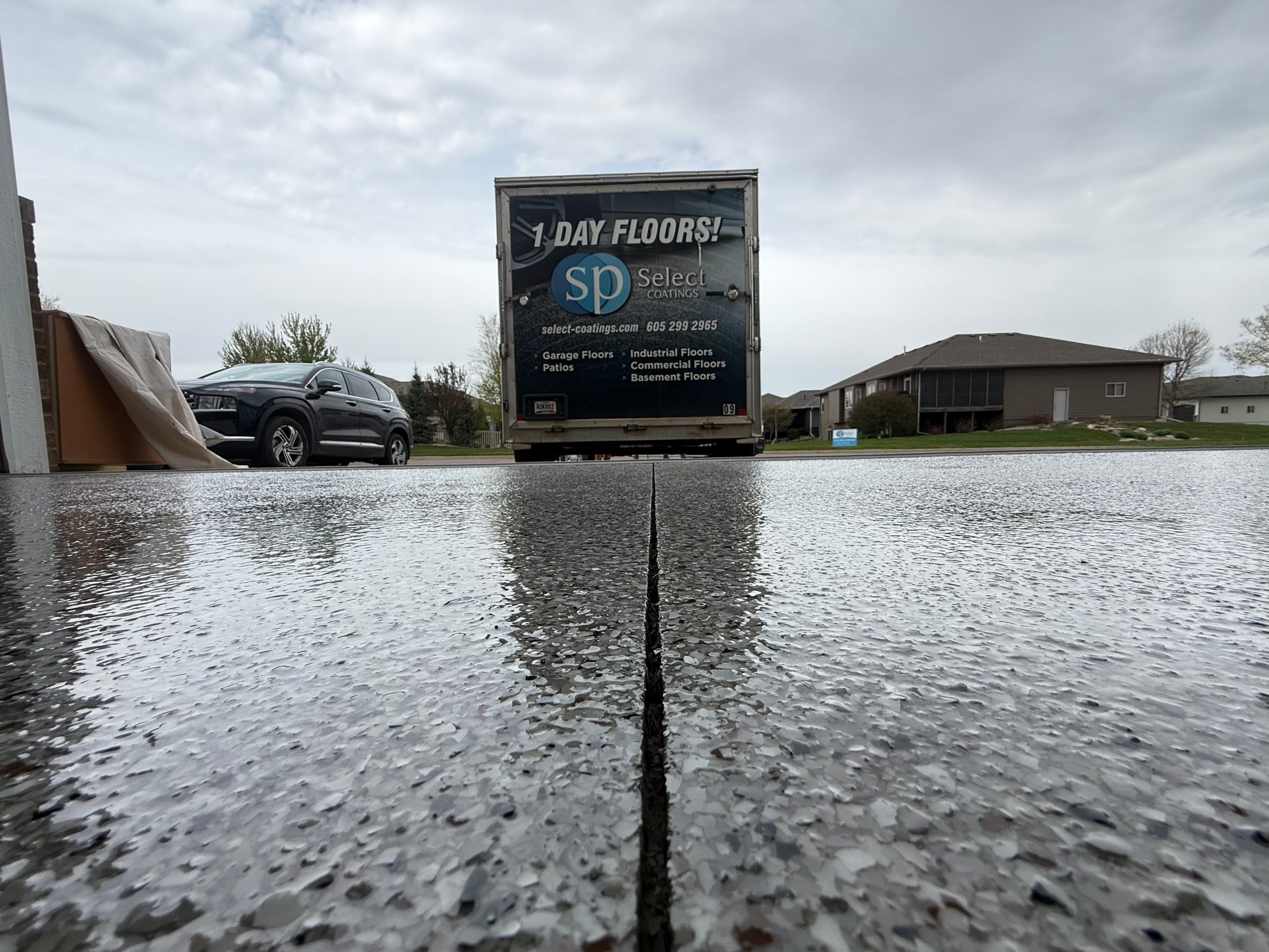 High-Gloss Epoxy Garage Floor Coating in Sioux Falls by Select Painting, Coatings & Garage Cabinets