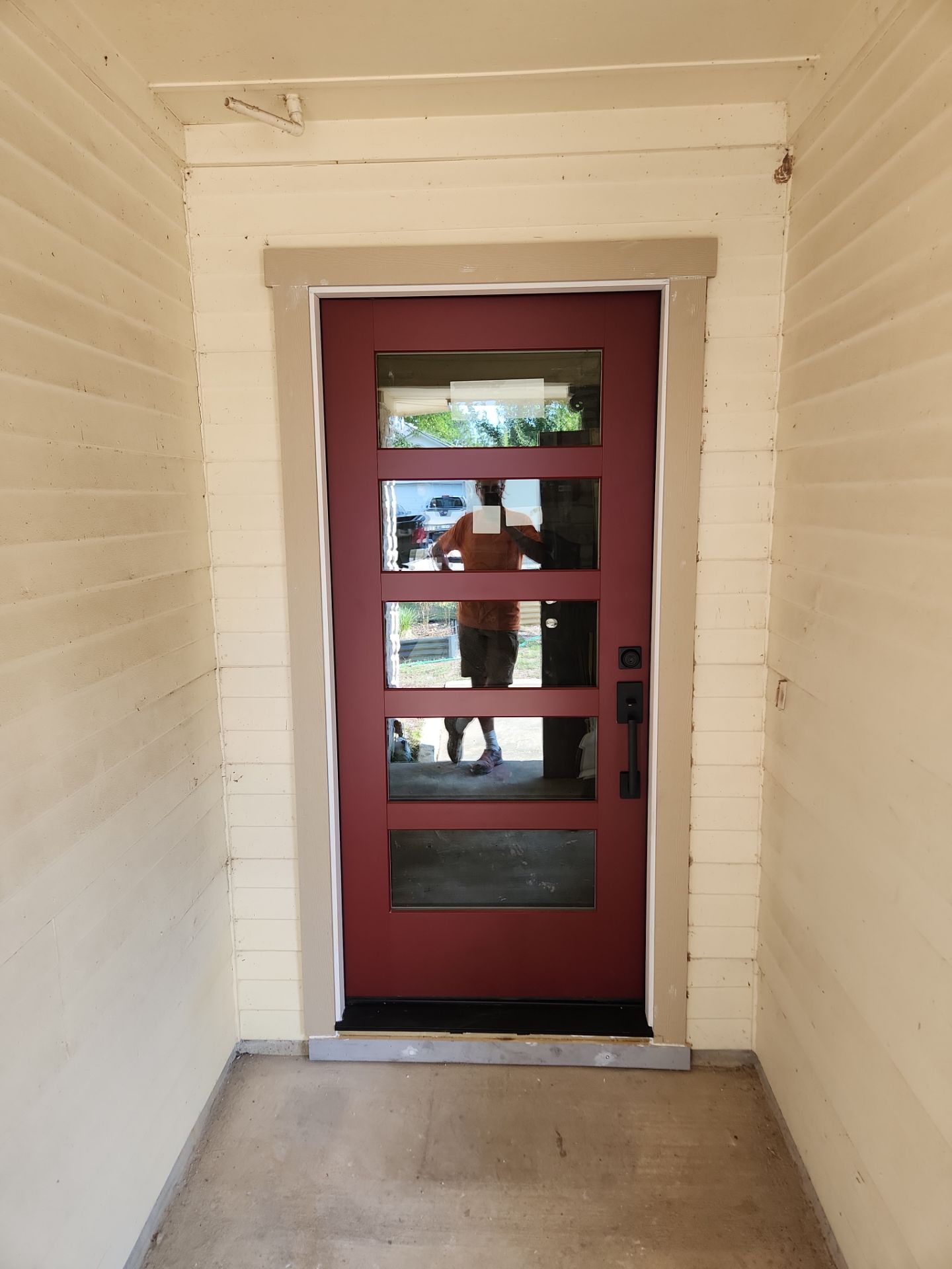 Custom Exterior Door Installation with Modern Glass Panes in Wells Branch Austin by RejuveNate Renovations LLC