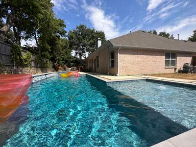 Geometric Pool with Raised Spa and Stone Decking