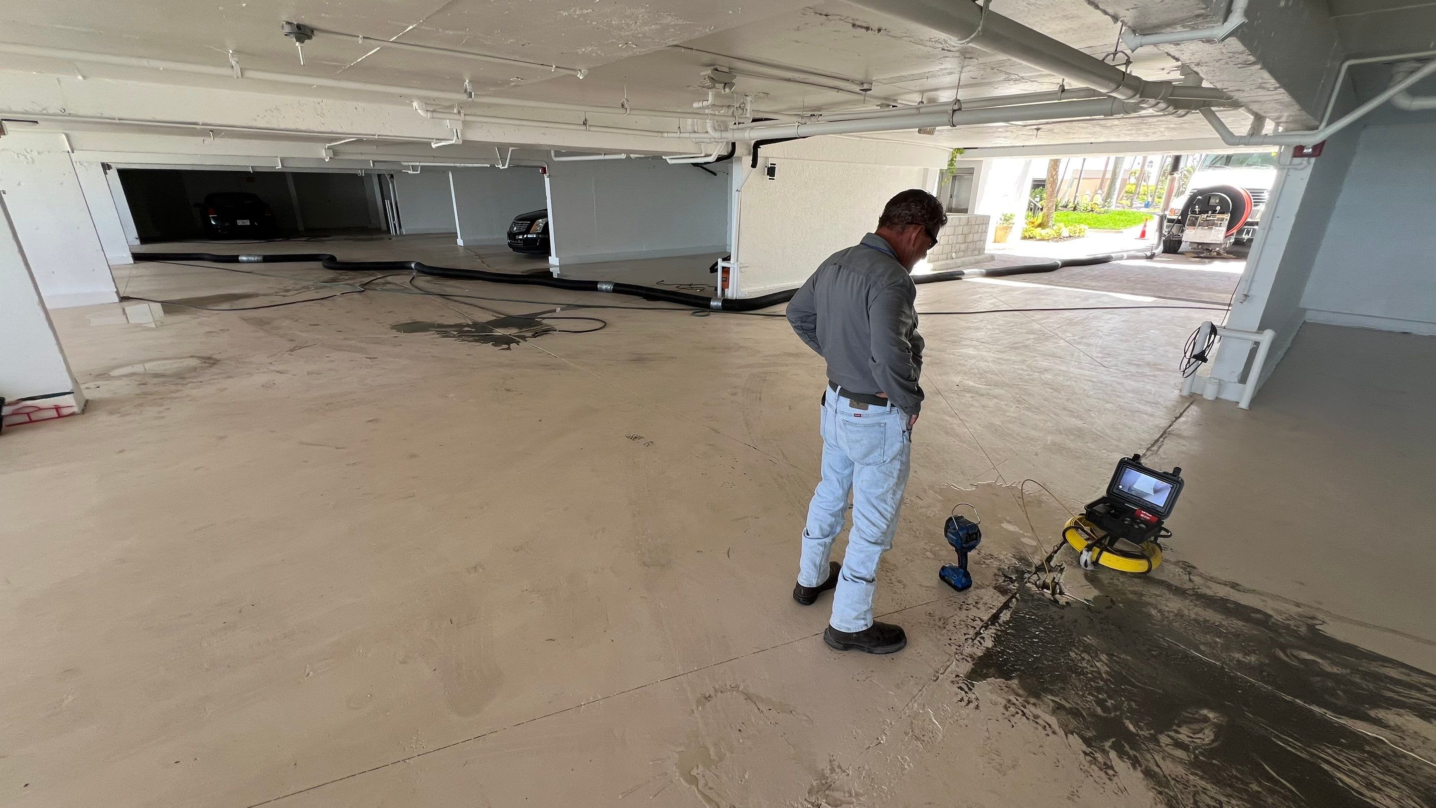 Isles of Capri Condo Parking Garage Drainage System Cleaning by APS Power & Water