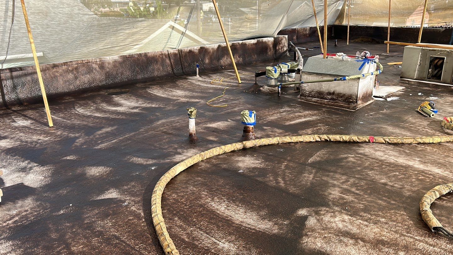 Foam Refurbish using Conklin Benchmark/PUMA XL coatings and spray foam; Also metal roofing around parapet wall by Straight Edge Roofing Inc