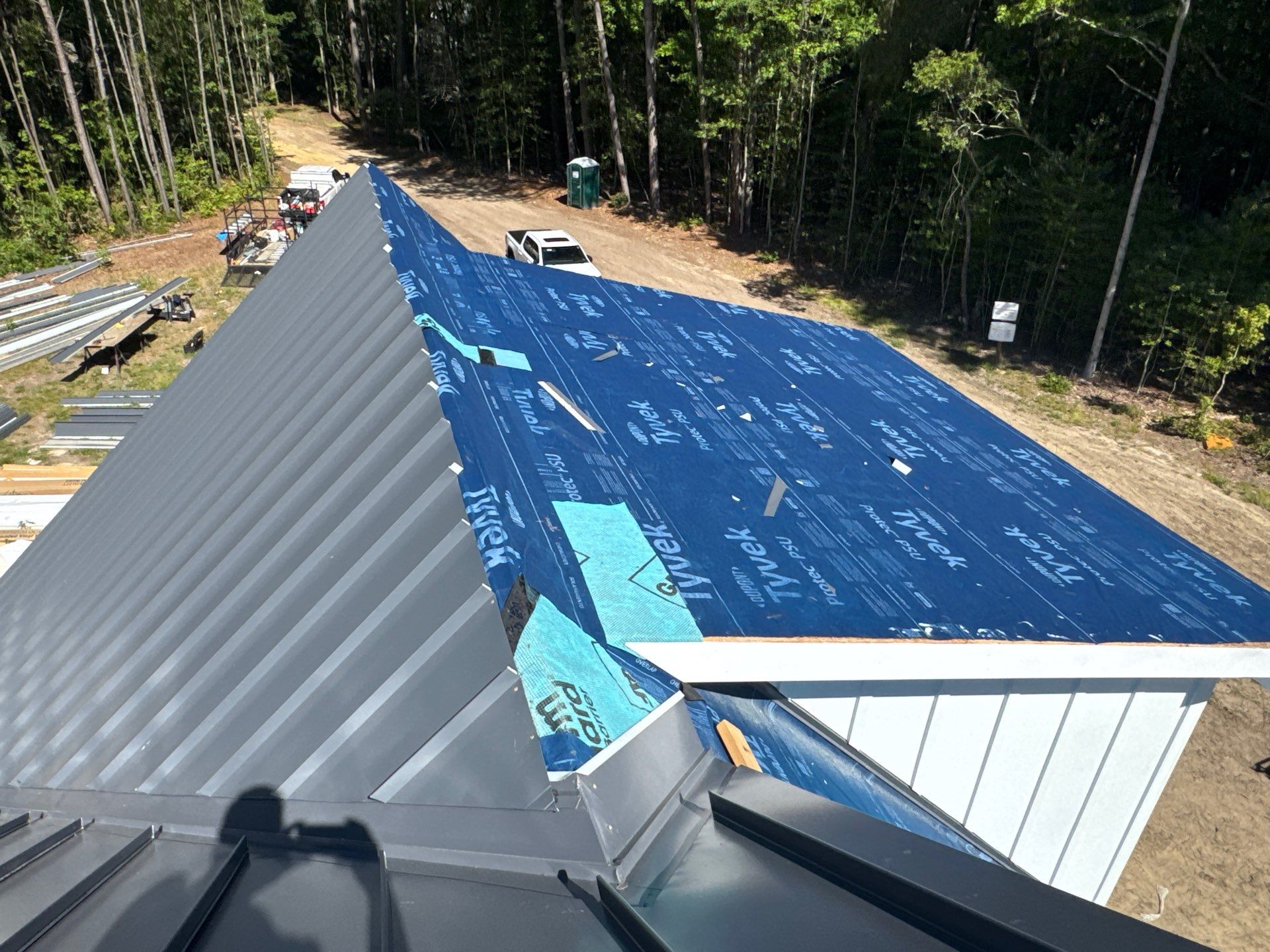 Custom New Construction Home Featuring Standing Seam Metal Roofing in Port Haywood by Cade Construction