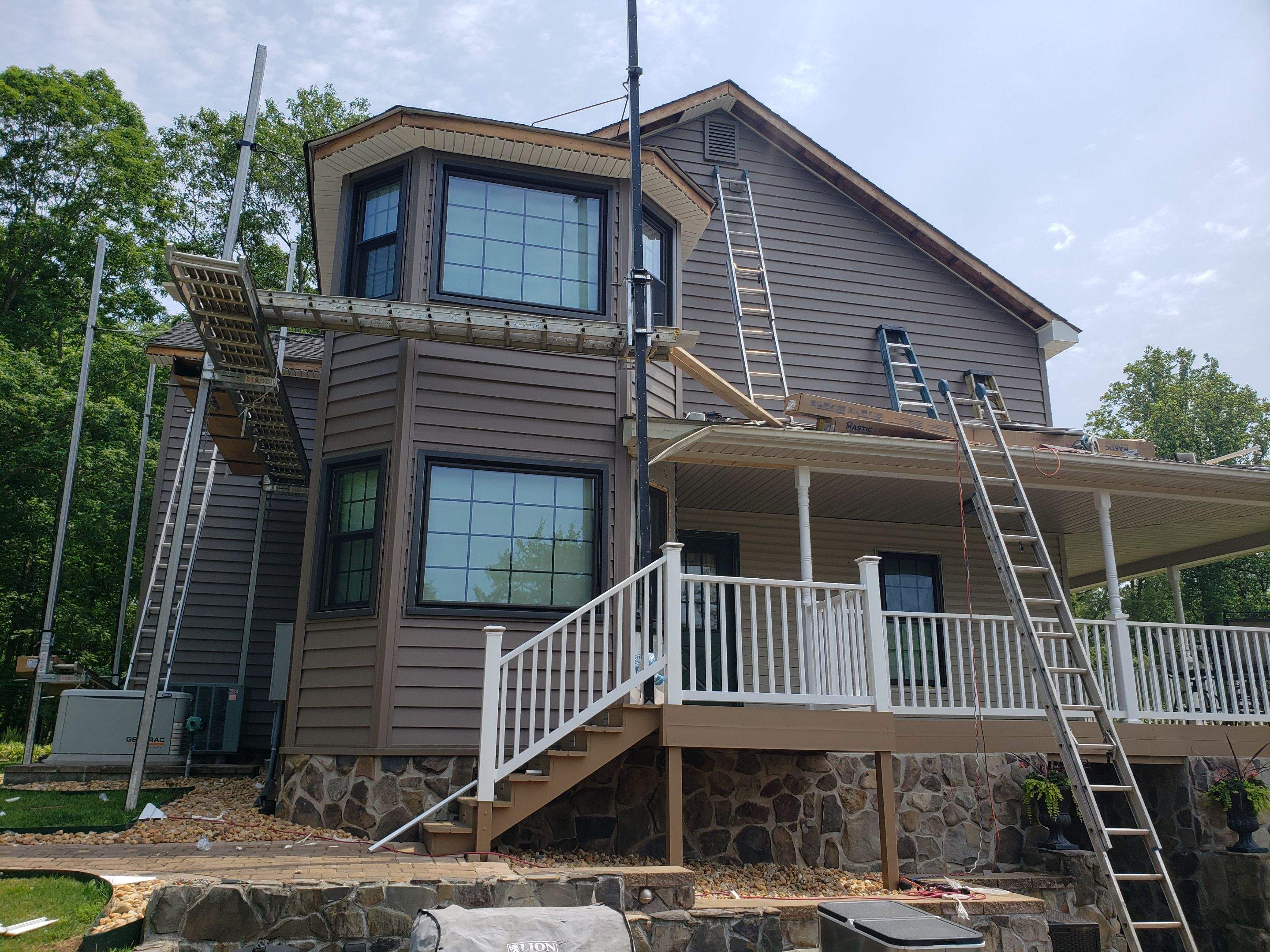Exterior remodel including window replacement by American Home Contractors