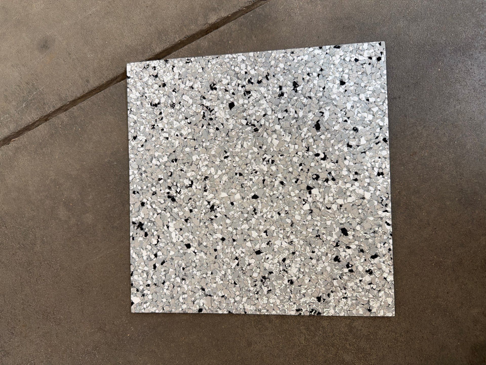 Feather Gray Epoxy Floor Coating Installation in Sioux Falls by Select Painting, Coatings & Garage Cabinets