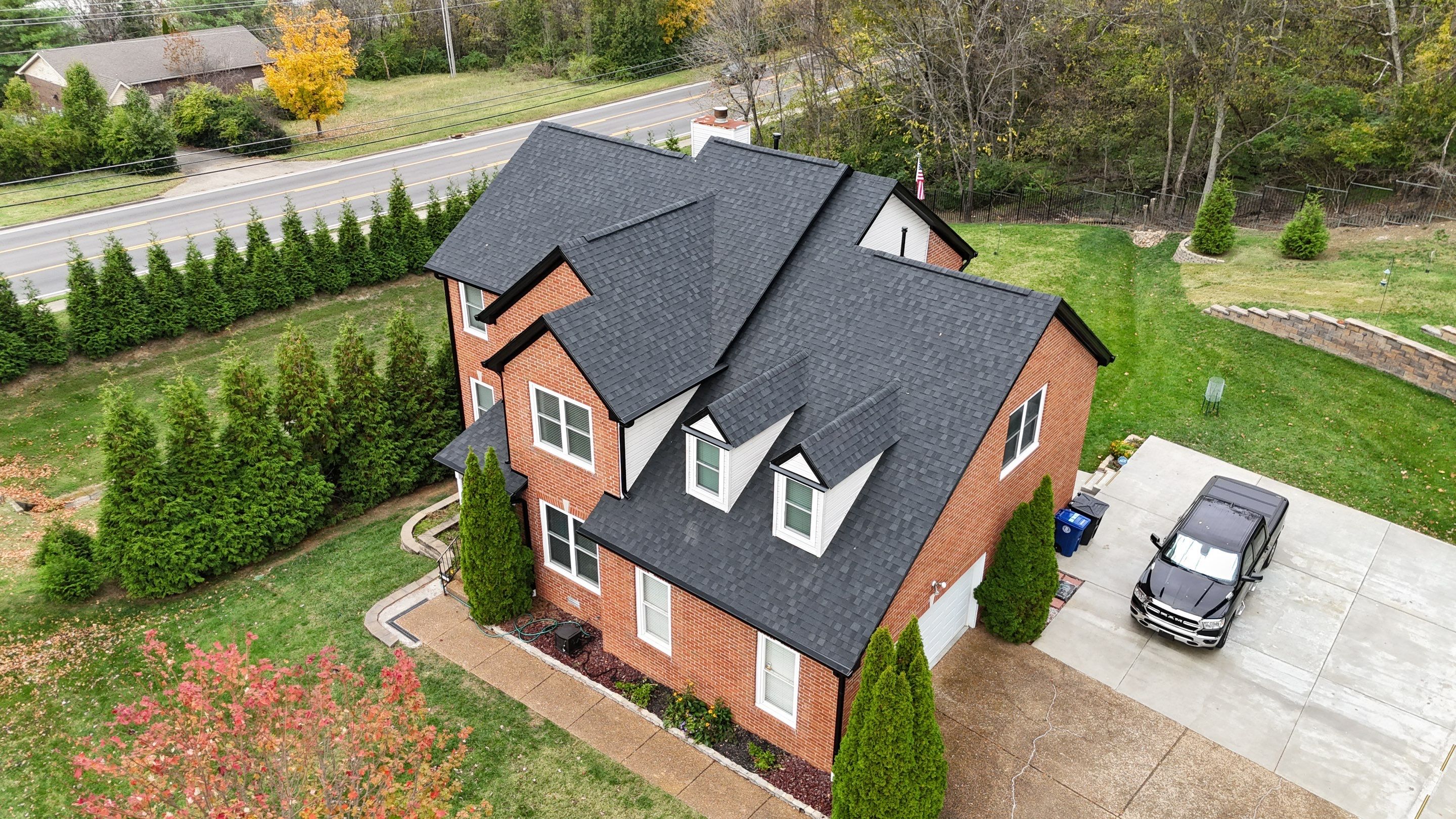 Charcoal Black Re-Roof & Gutters by Royal House LLC
