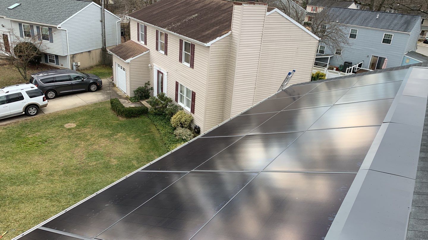 Roof Replacement with GAF Decotech integrated solar panels by American Home Contractors