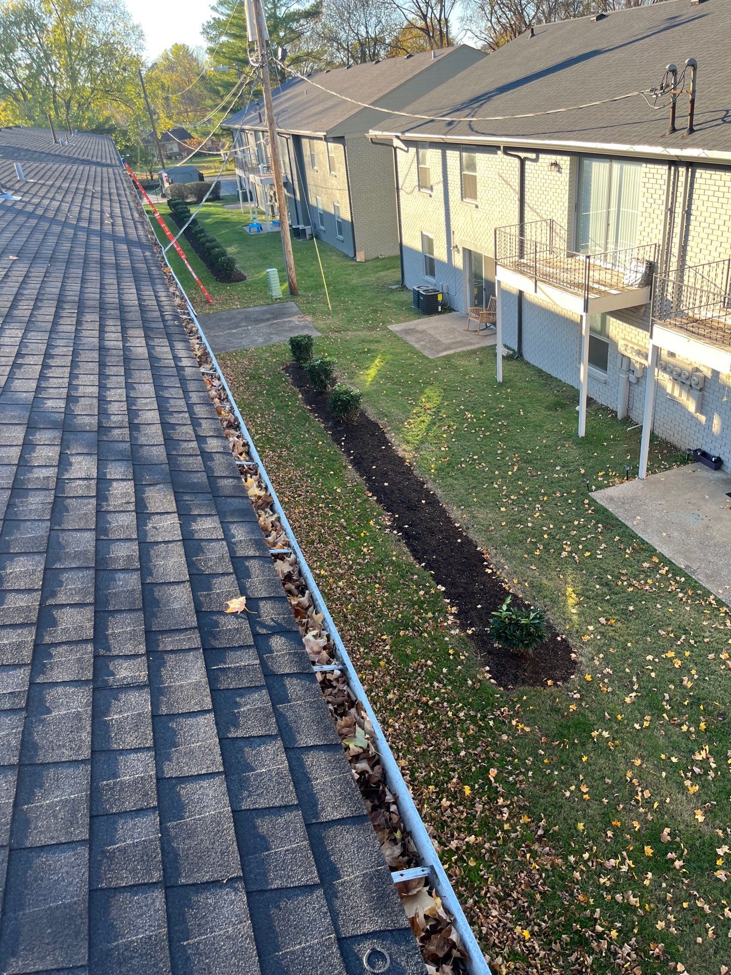 Commercial gutter cleaning Bowling Green, KY before photo with filled gutters