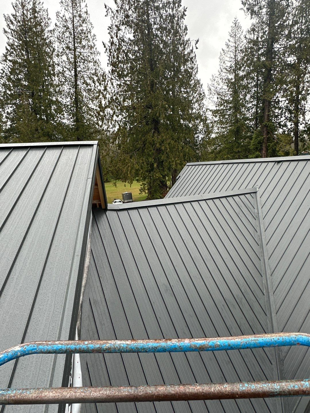 Residential Roofing Installation using 12" Prolok metal by Top Notch Roofing Inc