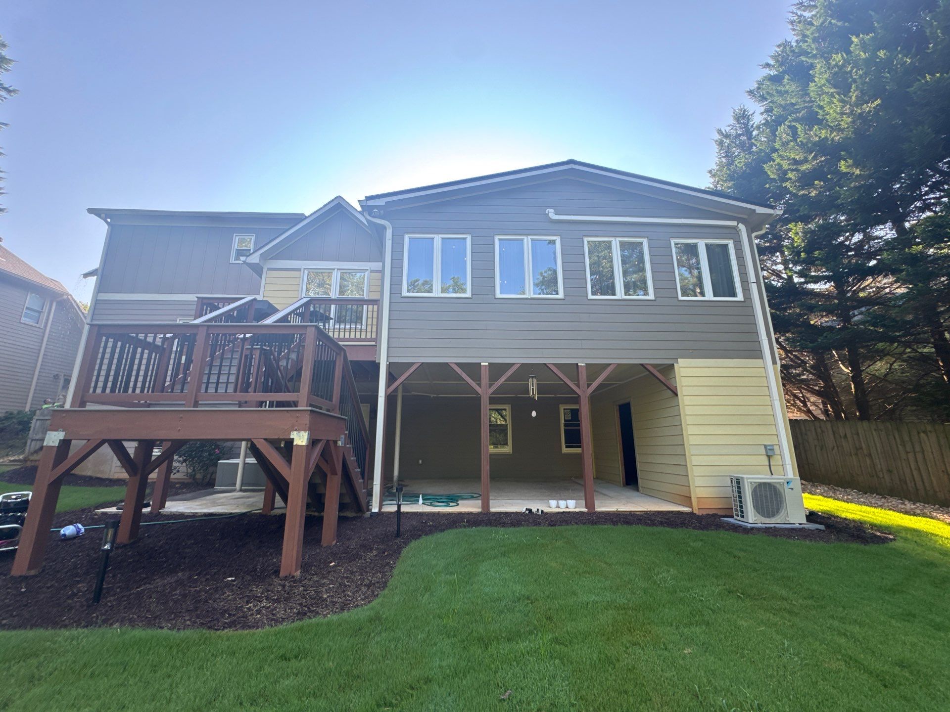 Exterior Modernization Featuring New Siding and Custom Wood Portico by Swift Home Renovations