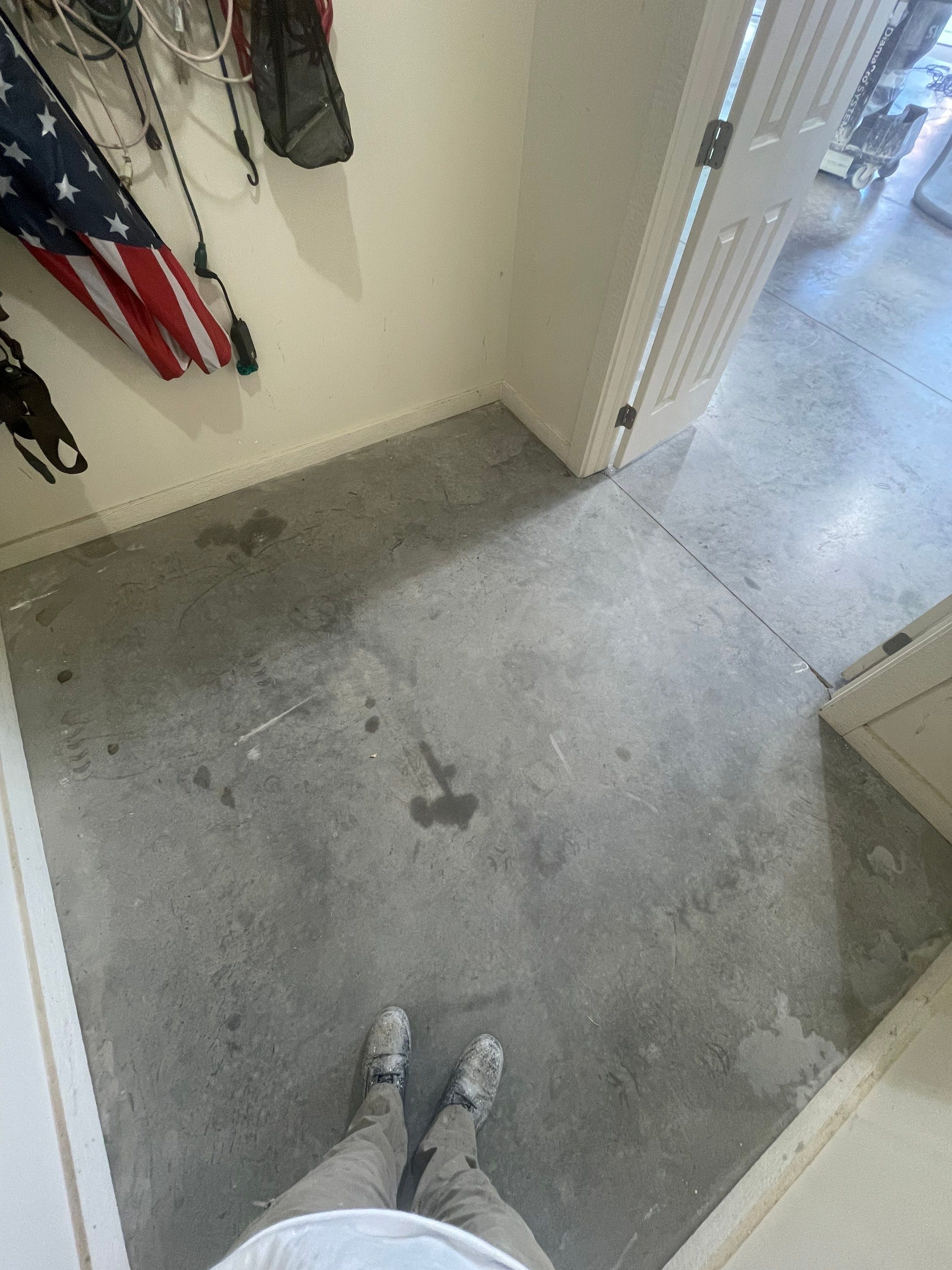 Coyote Flake Garage Floor Coating in Sioux Falls with Trench Drain by Select Painting, Coatings & Garage Cabinets