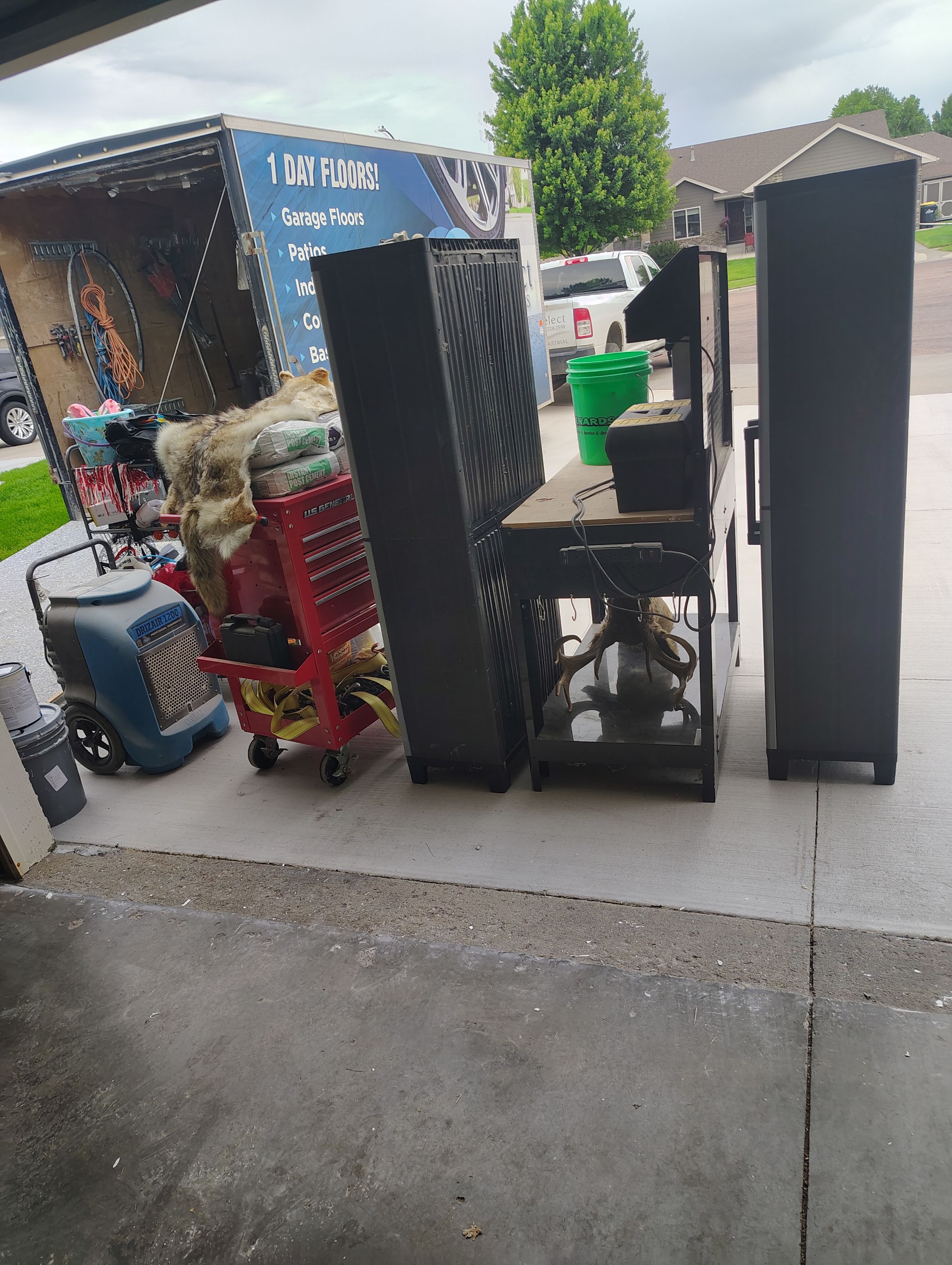 Custom Grey Speckled Epoxy Floor Coating for Sioux Falls Garage by Select Painting, Coatings & Garage Cabinets