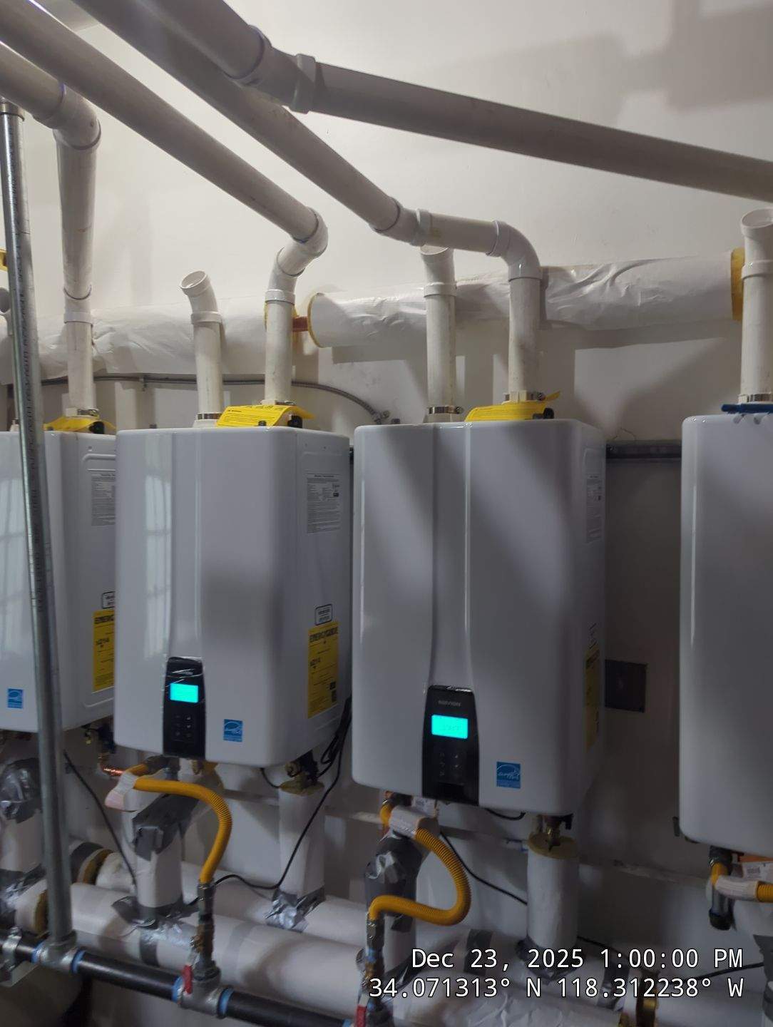 Central Tankless Domestic Hot Water System and Boiler Installation by Current Energy