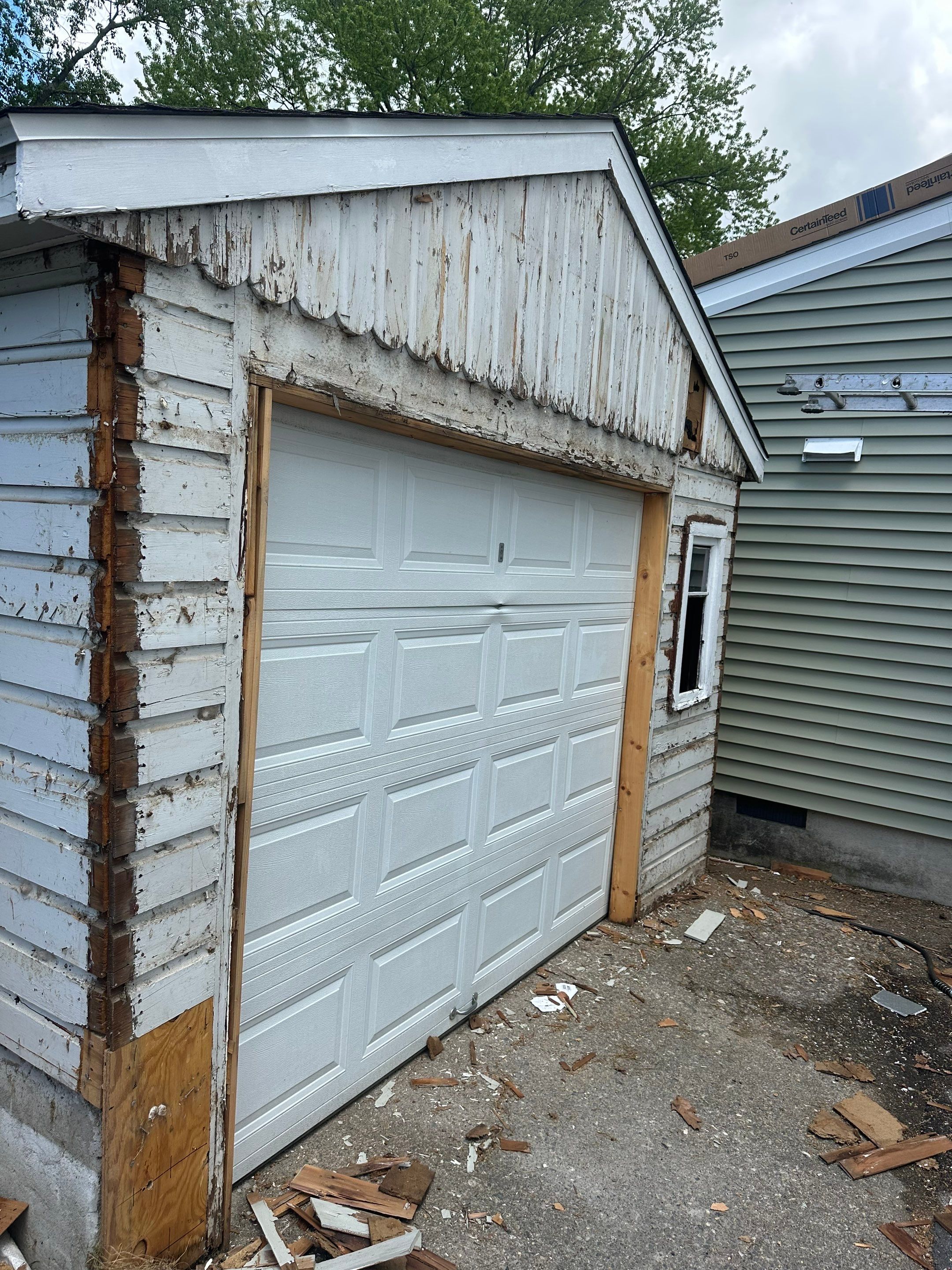 New Vinyl Siding Installation for Milford Home and Detached Garage by A Plus Exterior
