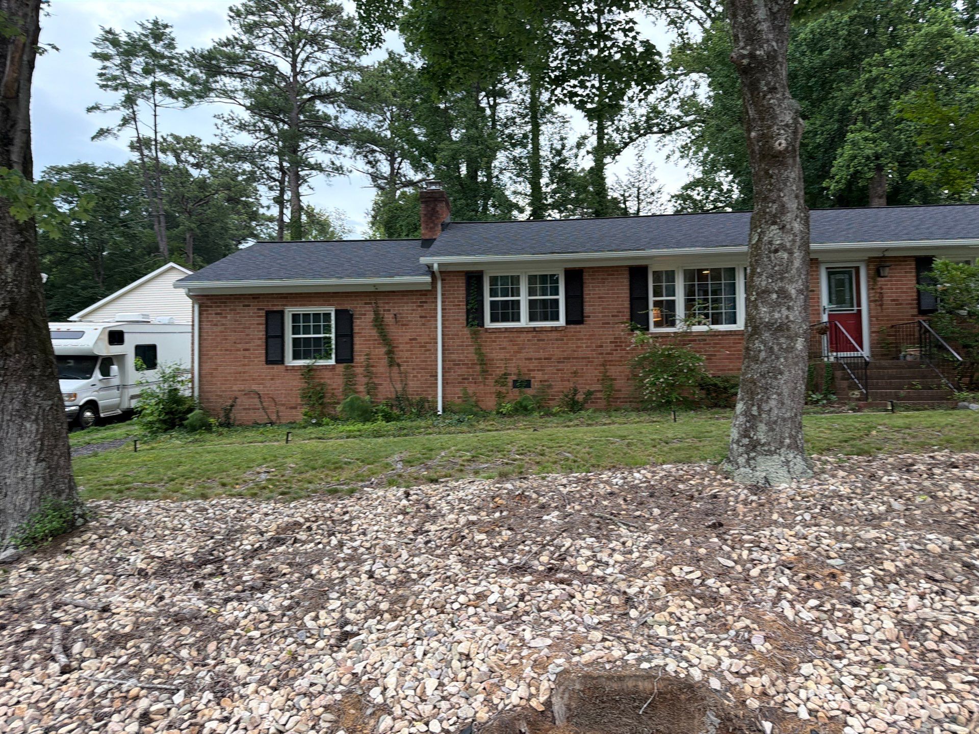 Asphalt Shingle Roof Replacement and Gutter Installation in Richmond by Cade Construction