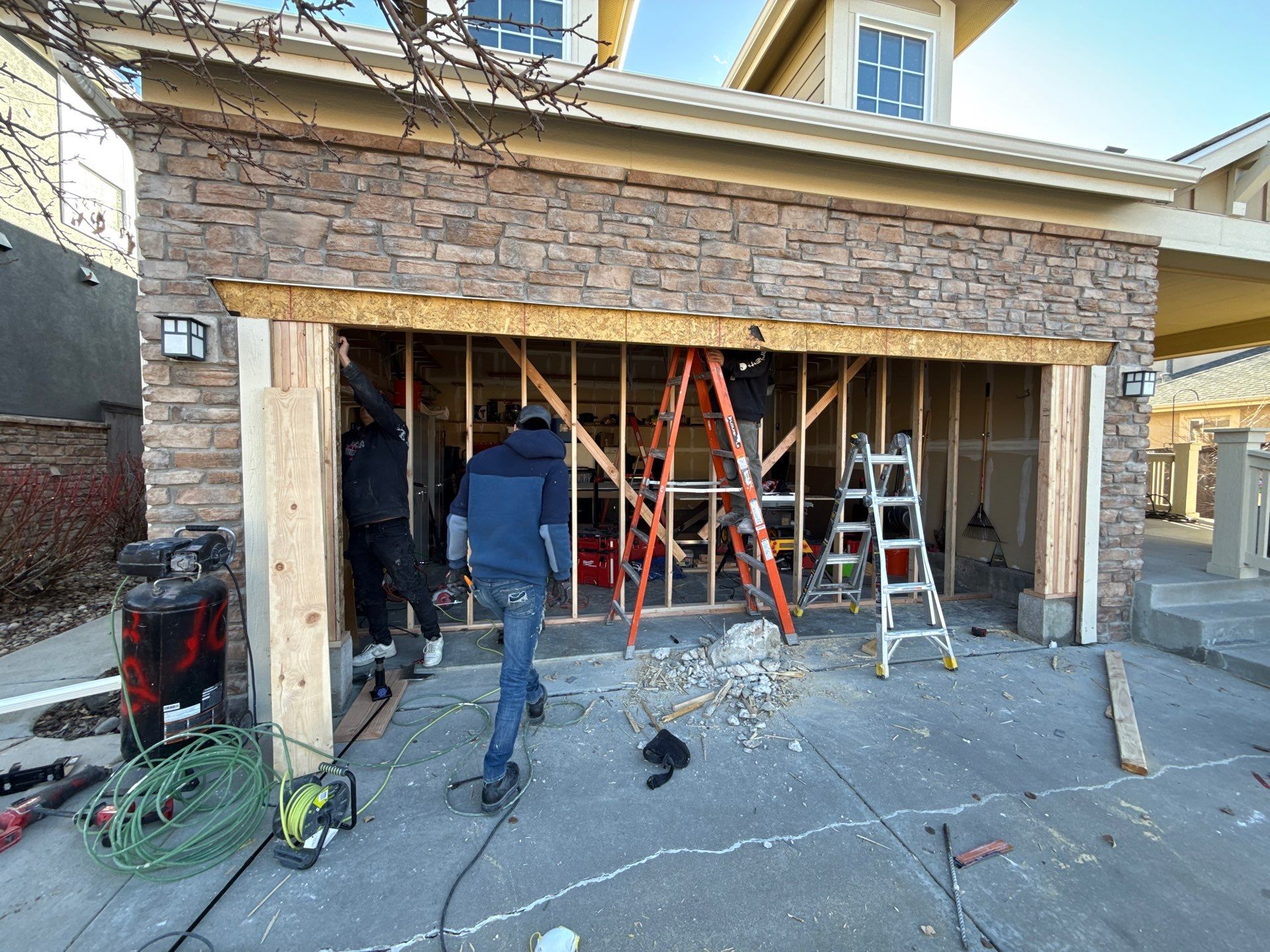 Garage door conversion by David & Goliath Contracting 