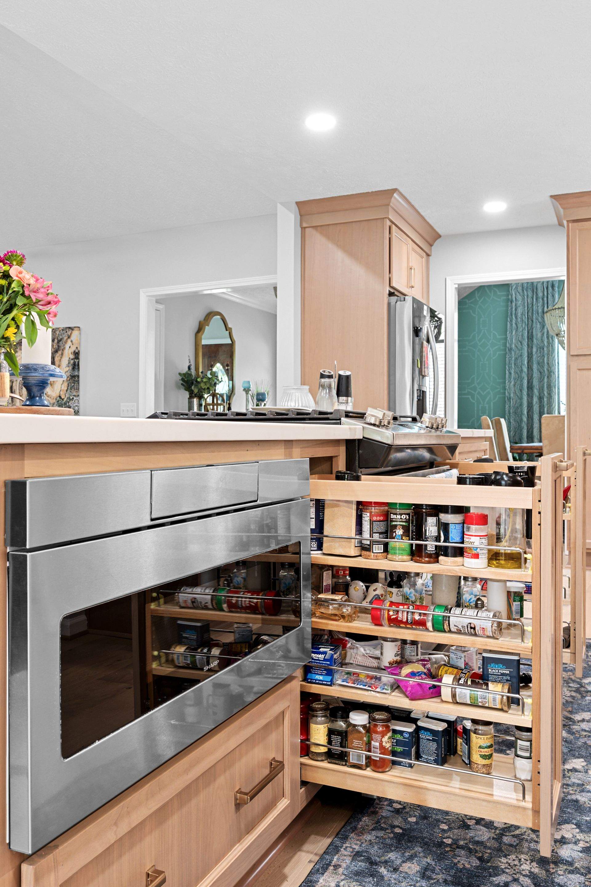 Modern Kitchen Remodel Featuring Quartz Backsplash, under cabinet lighintg, and a coffee bar in Mt. Juliet Tennessee by DeRo Renovations,LLC