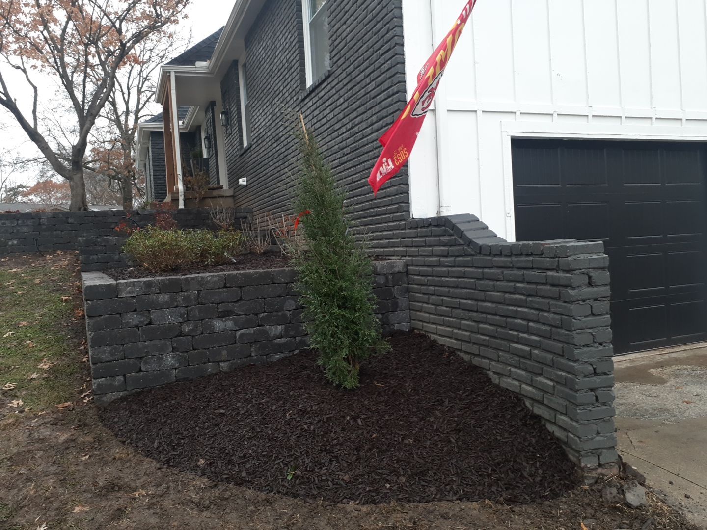Entire Home Landscape and Retaining Walls by LAND ESCAPES LLC