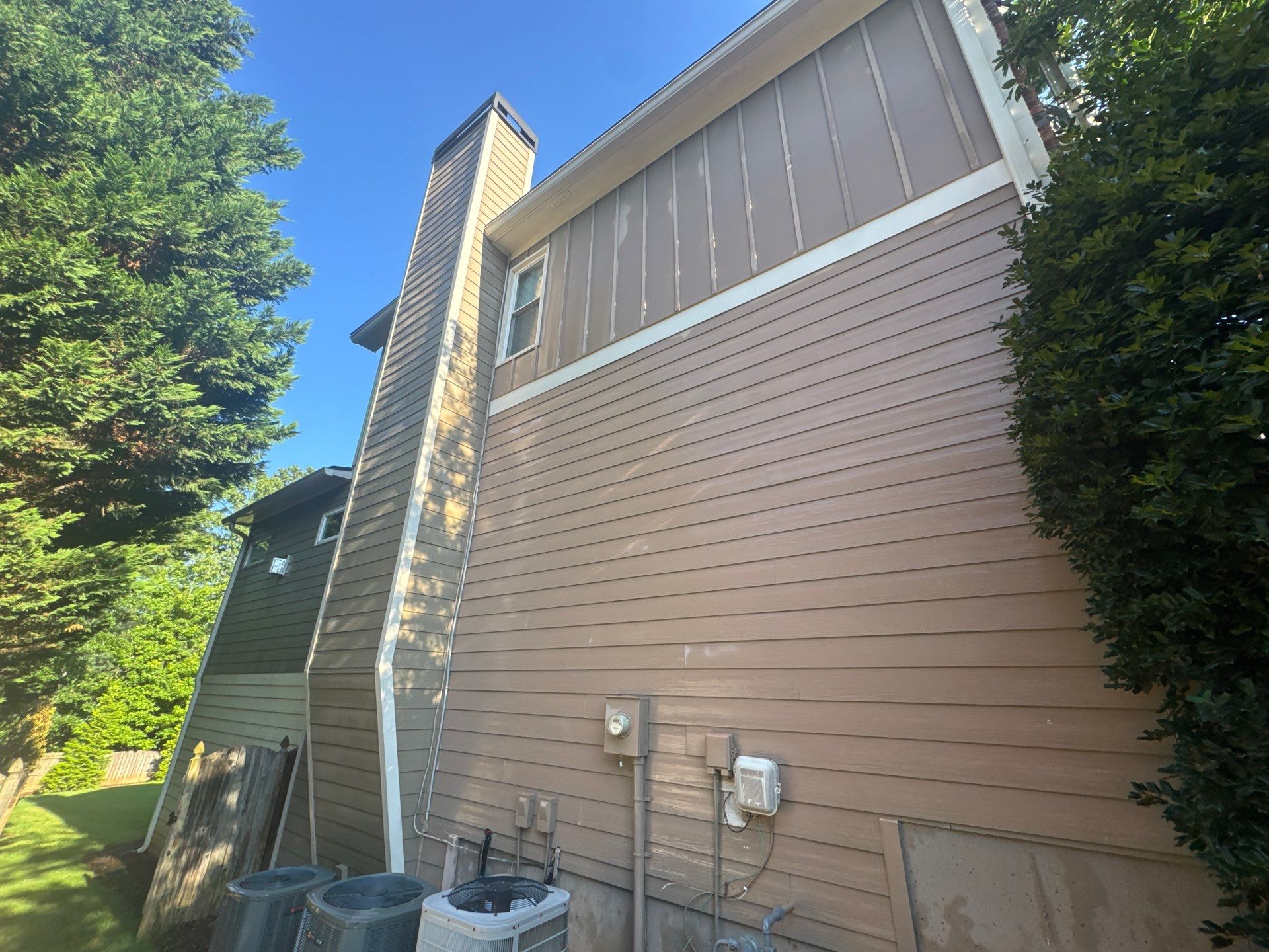 Exterior Modernization Featuring New Siding and Custom Wood Portico by Swift Home Renovations