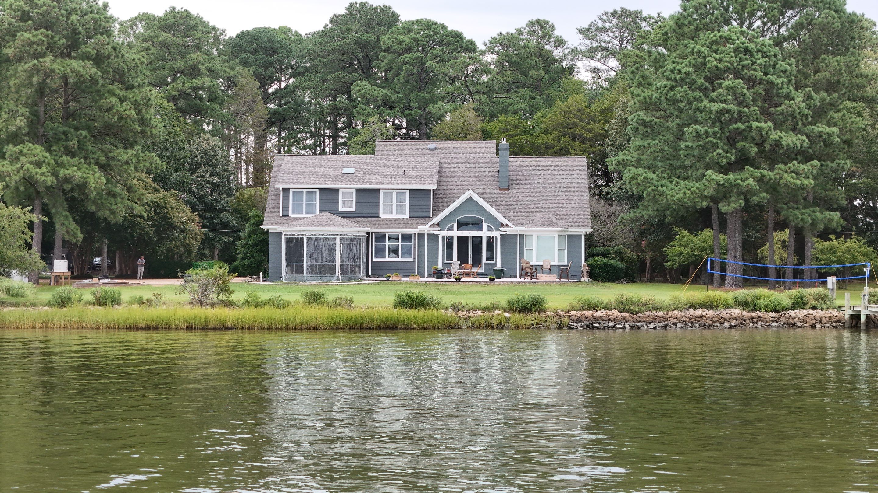 Roof Replacement and White Gutter Installation in Gloucester by Cade Construction