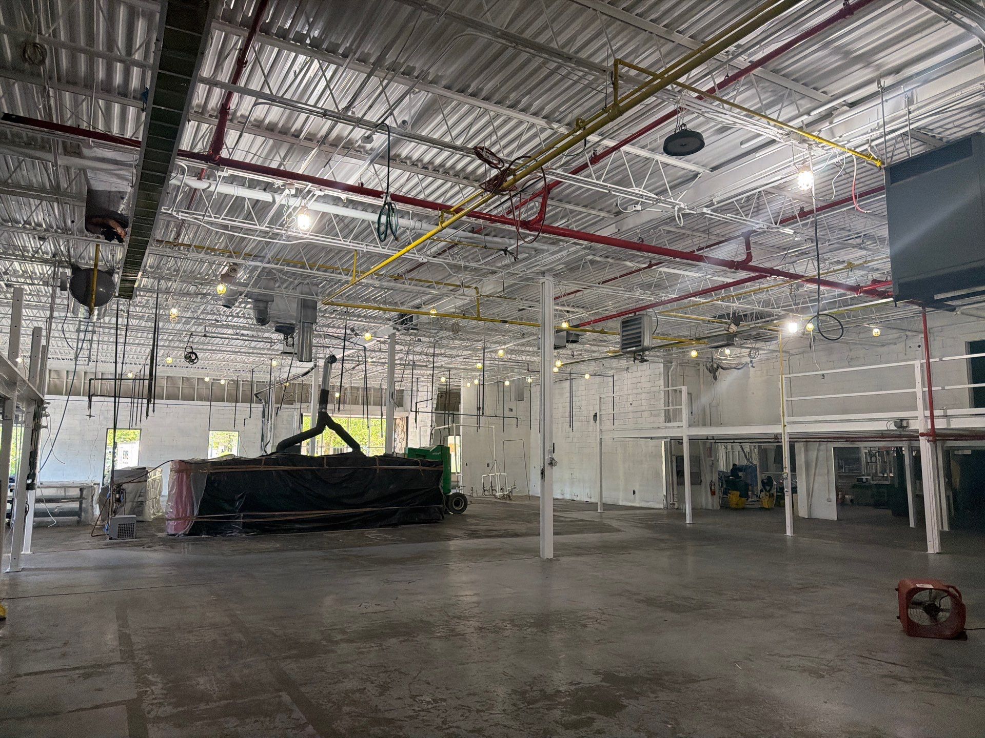 Industrial Warehouse Fire Damage Cleaning and Spray Sealing in Islandia by EMS Restoration Corp