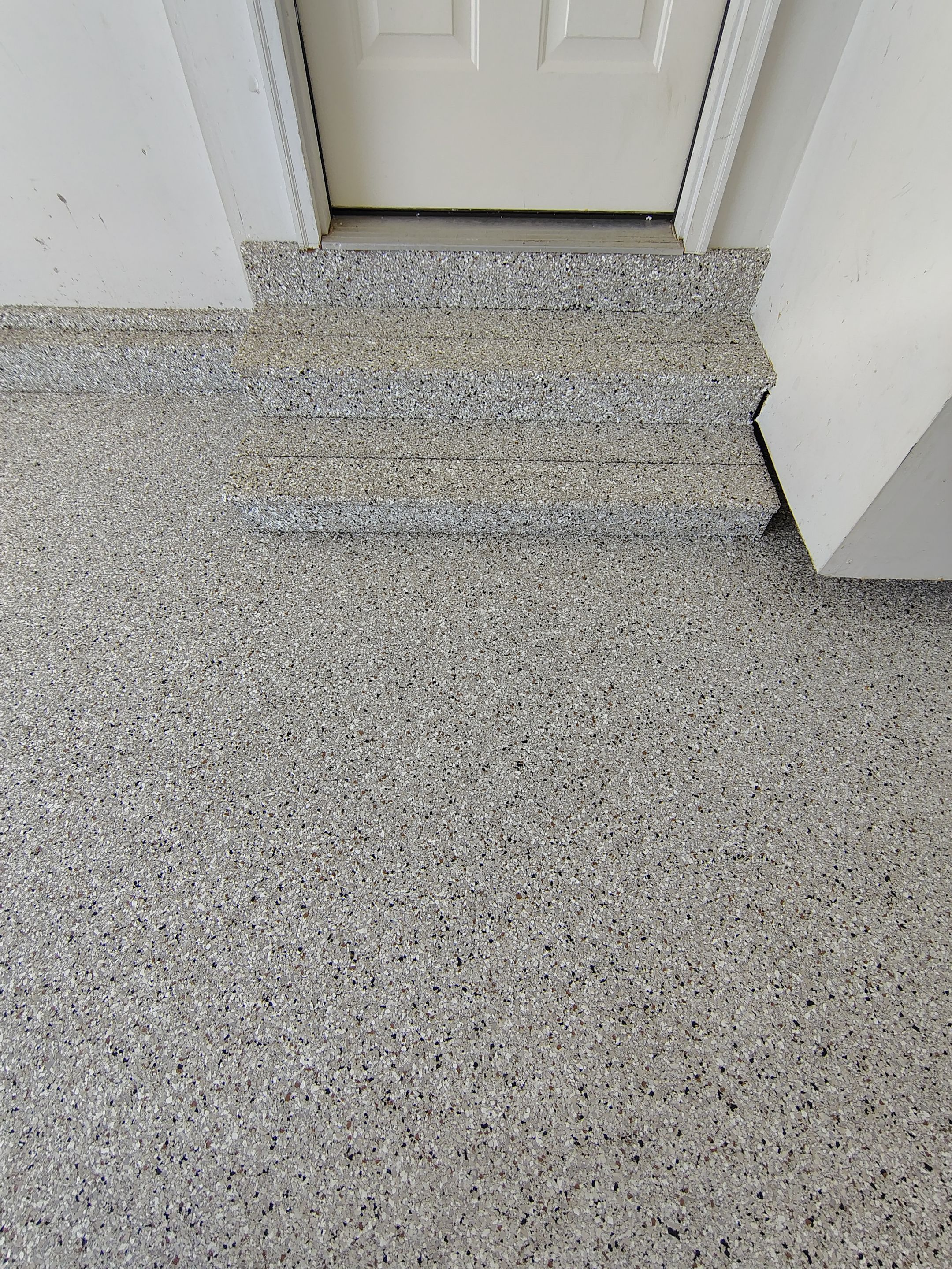 Decorative Chip Epoxy Garage Floor Coating in Sioux Falls by Select Painting, Coatings & Garage Cabinets