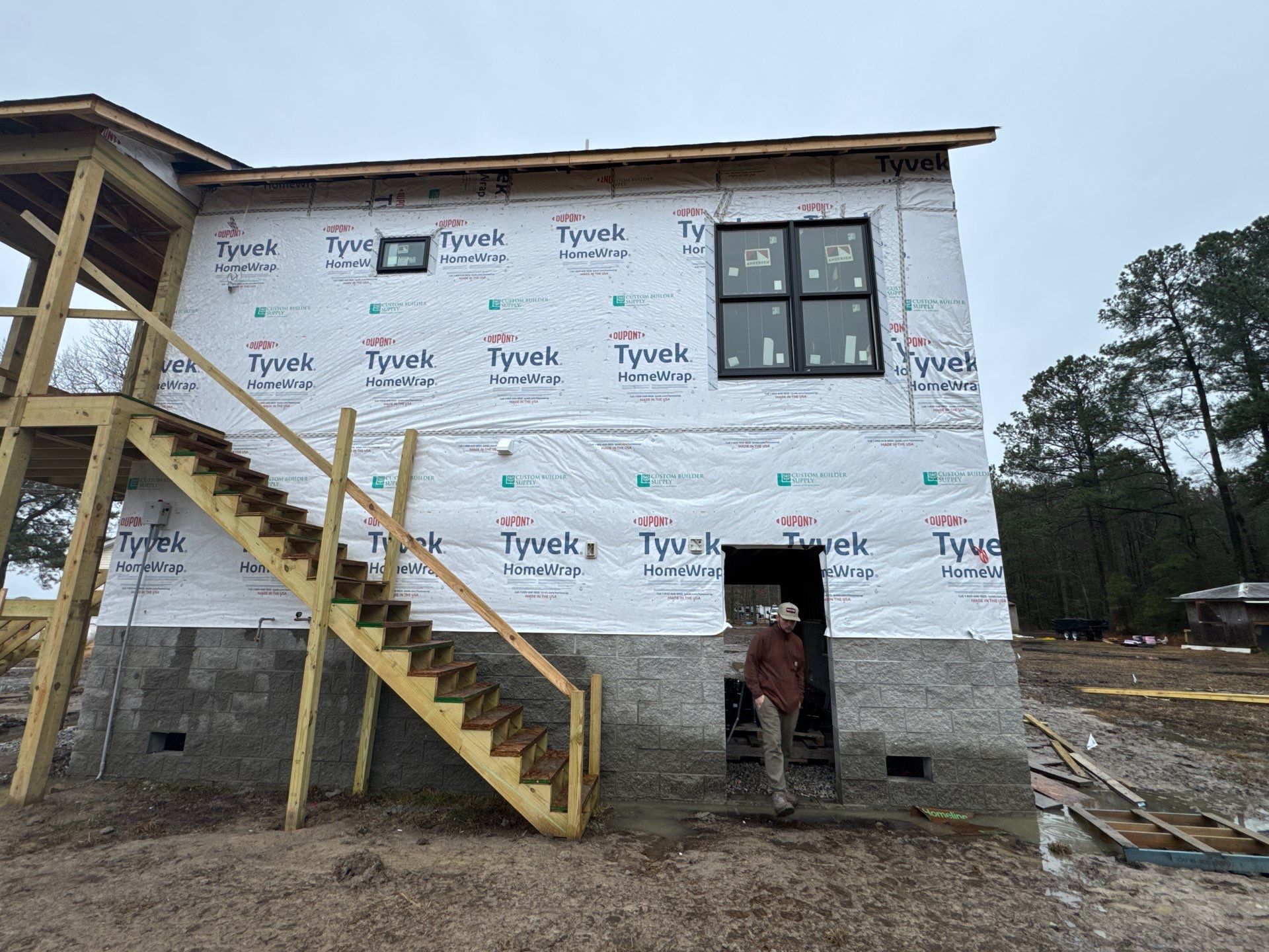 Two-Story Custom Home With Board and Batten Siding by Cade Construction