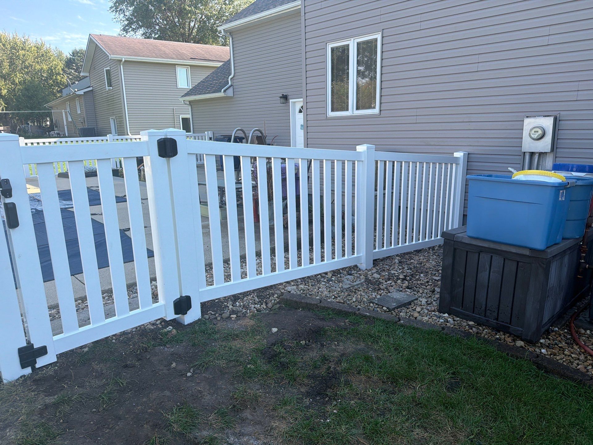 White Vinyl Picket Pool Fence Installation in Waterloo, Iowa by Perfect Picket Fence and Stain