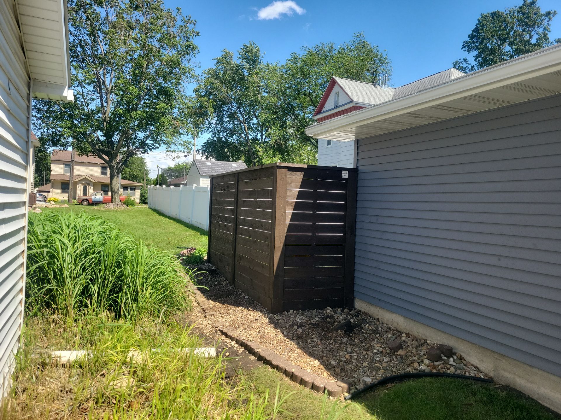 Custom Horizontal Slat Privacy Cedar Chocolate Screen Installation in Hudson by Perfect Picket Fence and Stain