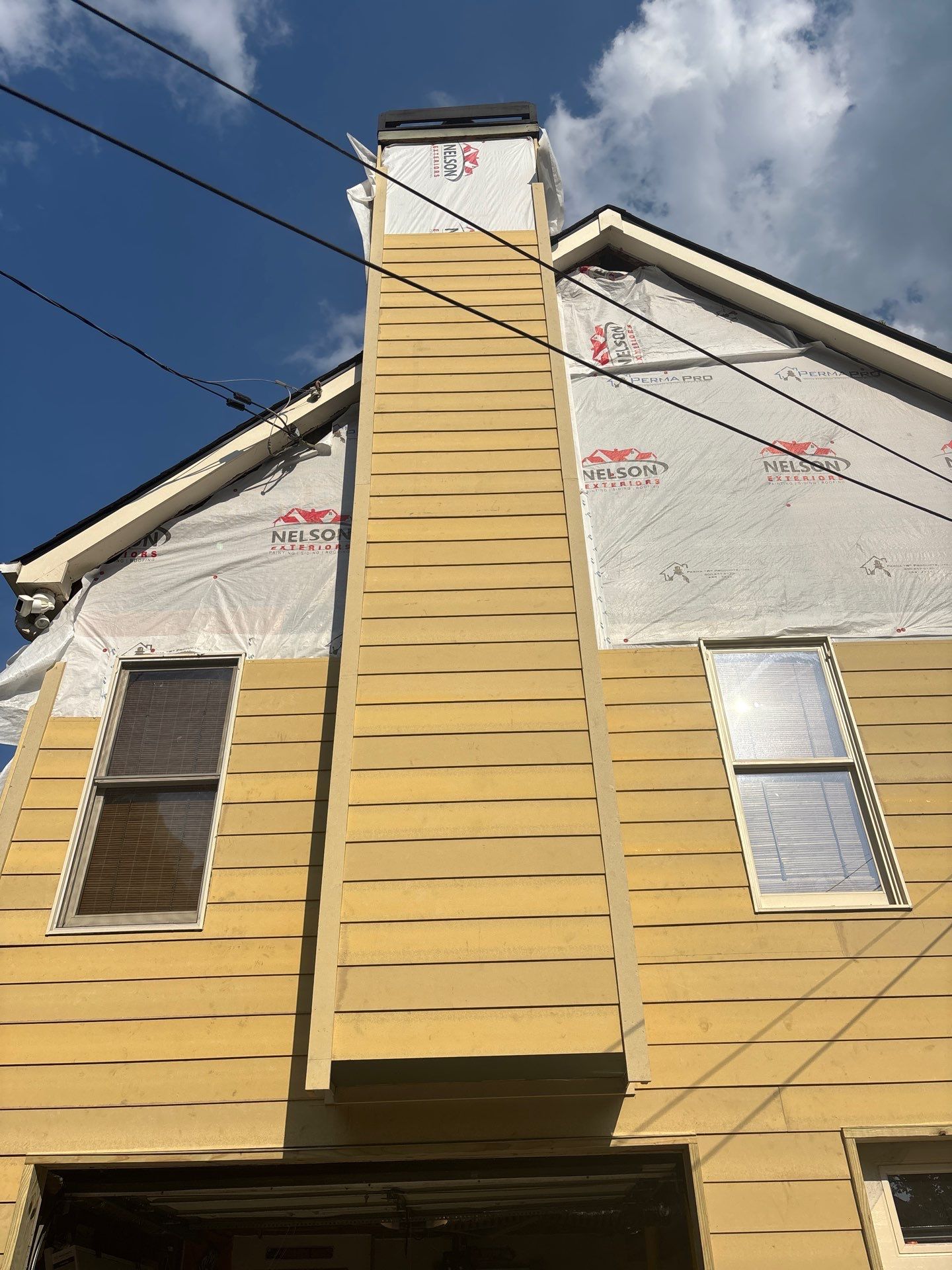 James Hardie Siding Install, Rotten Wood and Gutter Replacement and Exterior Painting by Nelson Exteriors 
