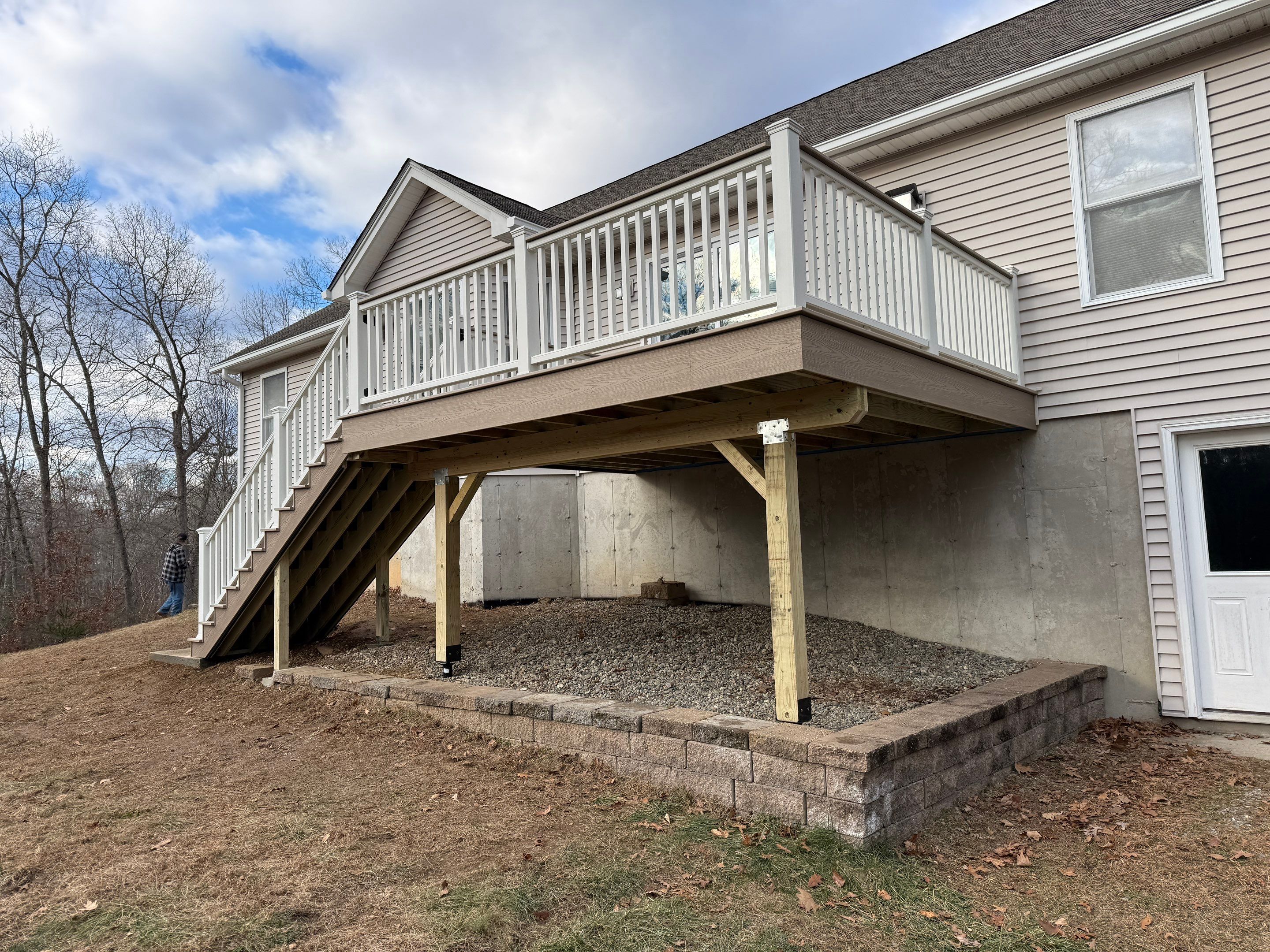 Replacement deck using Trex Transcend Ropeswing and White Transcend railings, with gate by DiGiorgi Roofing and Siding Inc