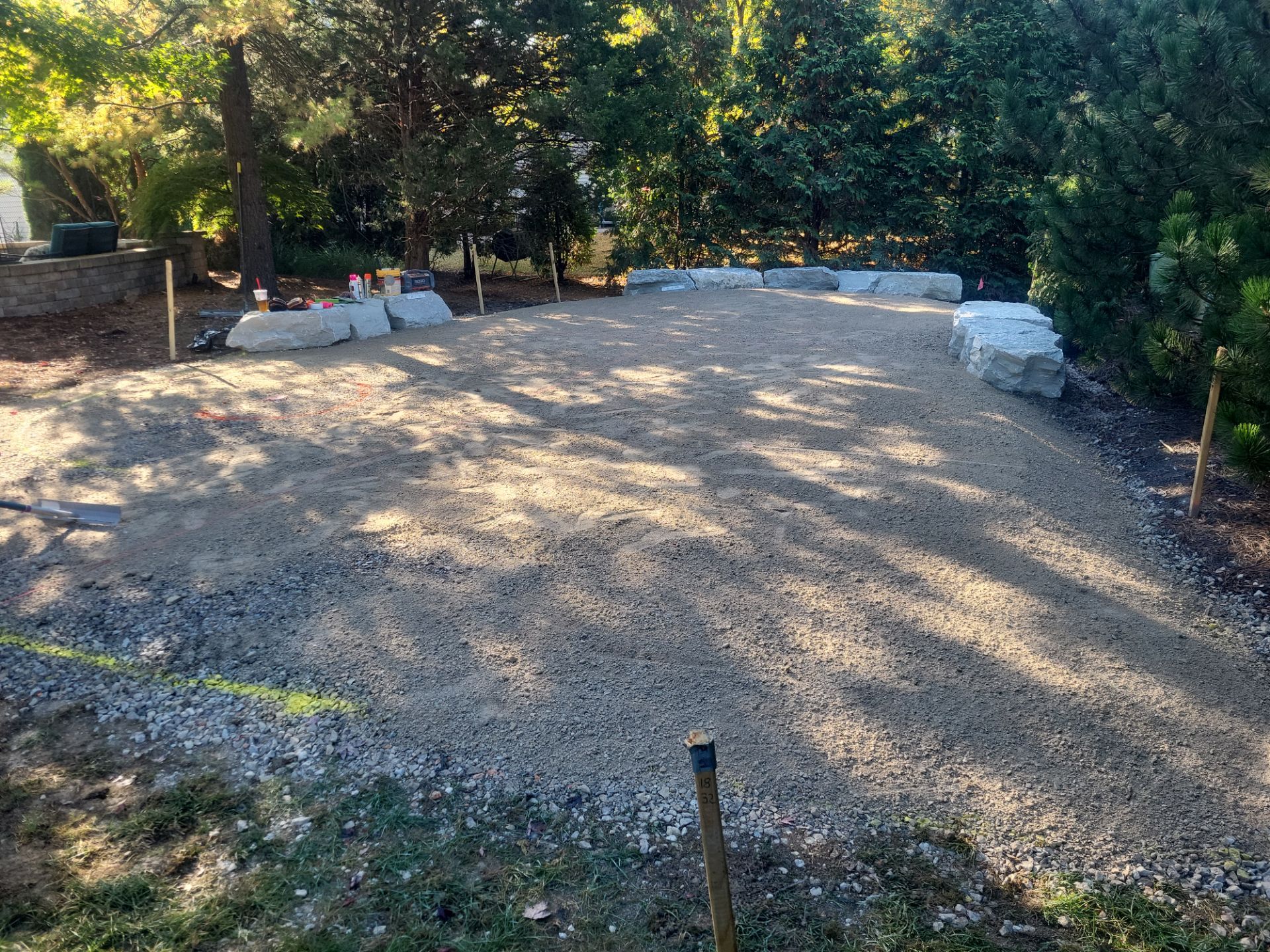 Custom Backyard Putting Green around Landscape Boulders in Hilliard by Southwest Greens Midwest