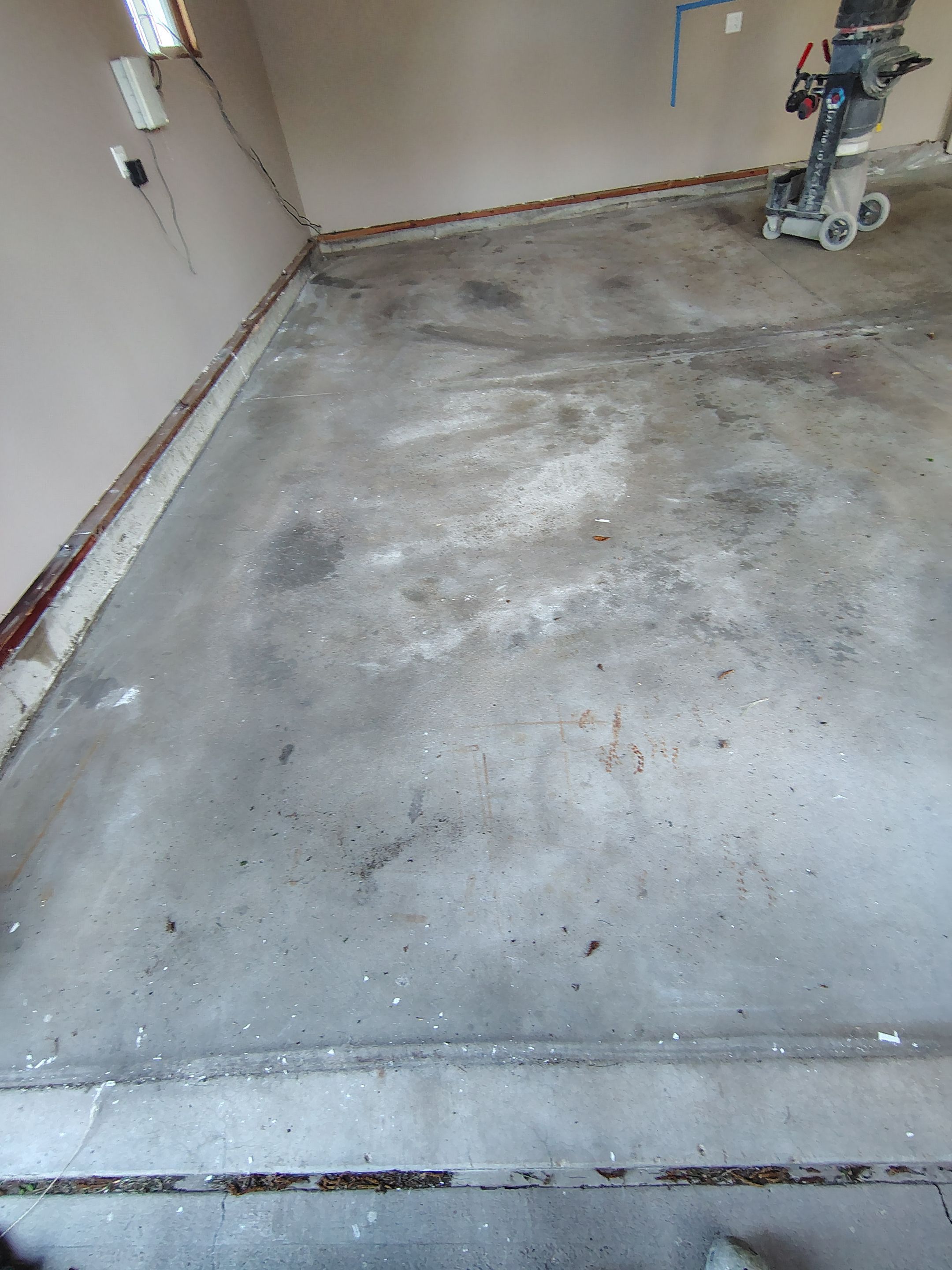Sioux Falls Garage Concrete Repair and Epoxy Flake Floor Coating by Select Painting, Coatings & Garage Cabinets