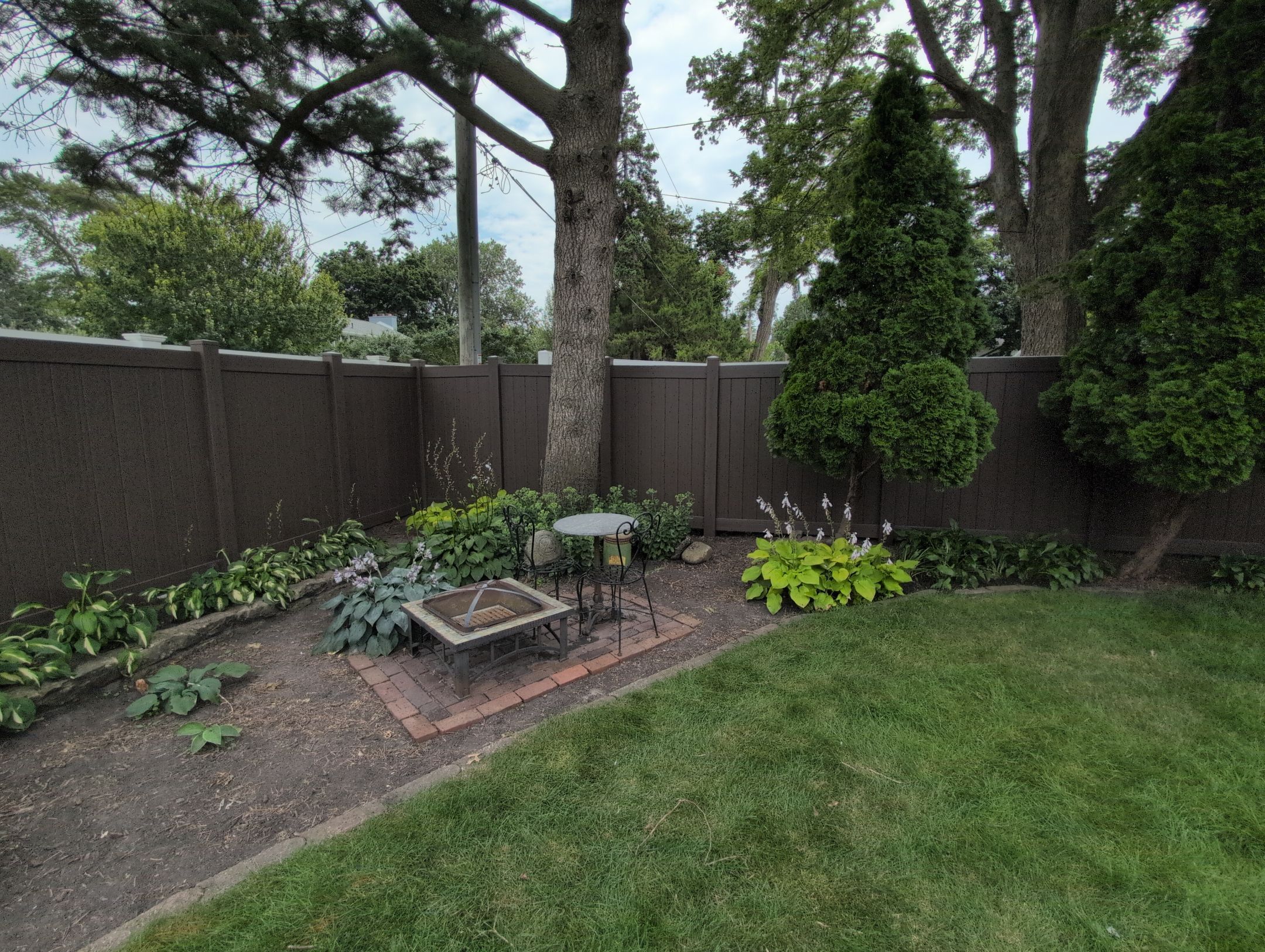 Walnut Vinyl Privacy Fence Installation in Waterloo by Perfect Picket Fence and Stain