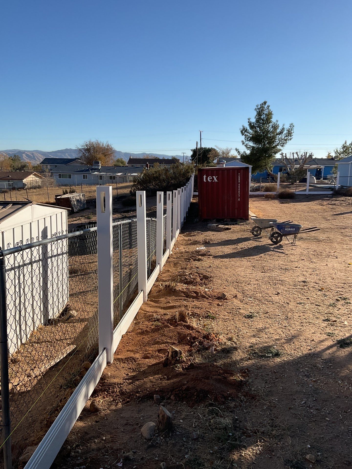 Fence Installation using vinyl and chain link  by Fence Guys Inc. 