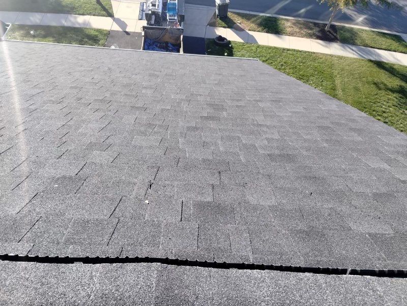 Residential Roofing Installation using Atlas Pinnacle Pristine Black Architectural Shingles by Frederick Roof Repair