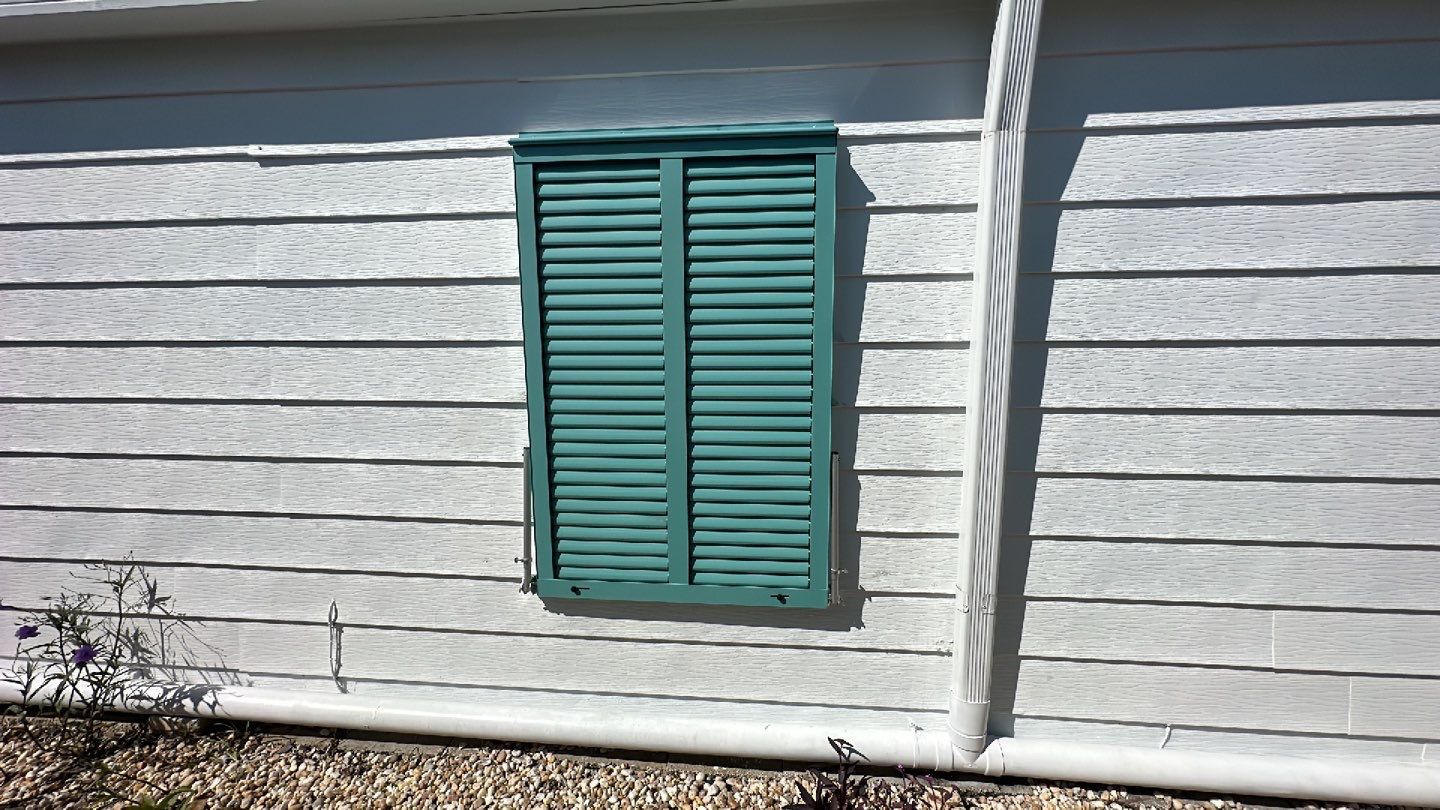 Hurricane Rated Bahama Shutters in Pastel Turquoise by Smart Guard Shutters