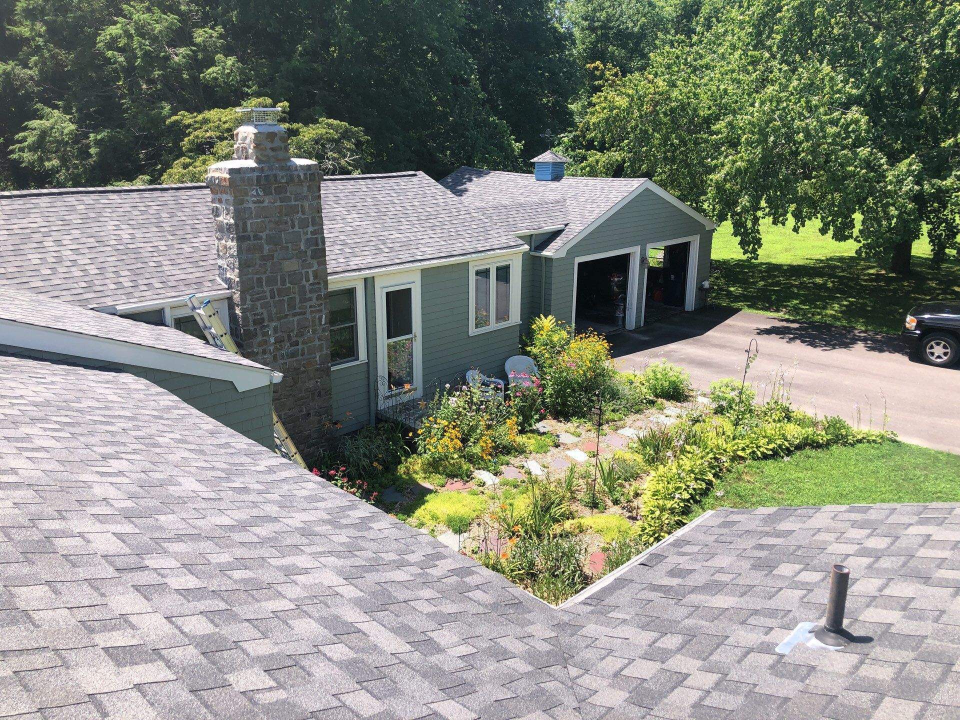 Pewterwood Roofs by Pinnacle Roofing & Skylights