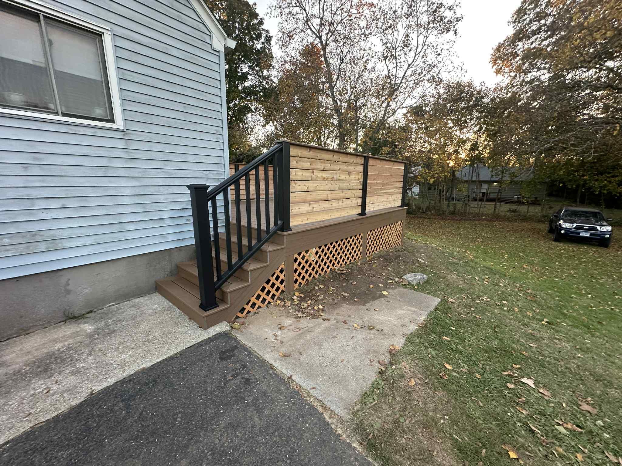Deck Replacement with Trex Lineage Jasper, Custom Railings and Trex colored fascia by DiGiorgi Roofing and Siding Inc