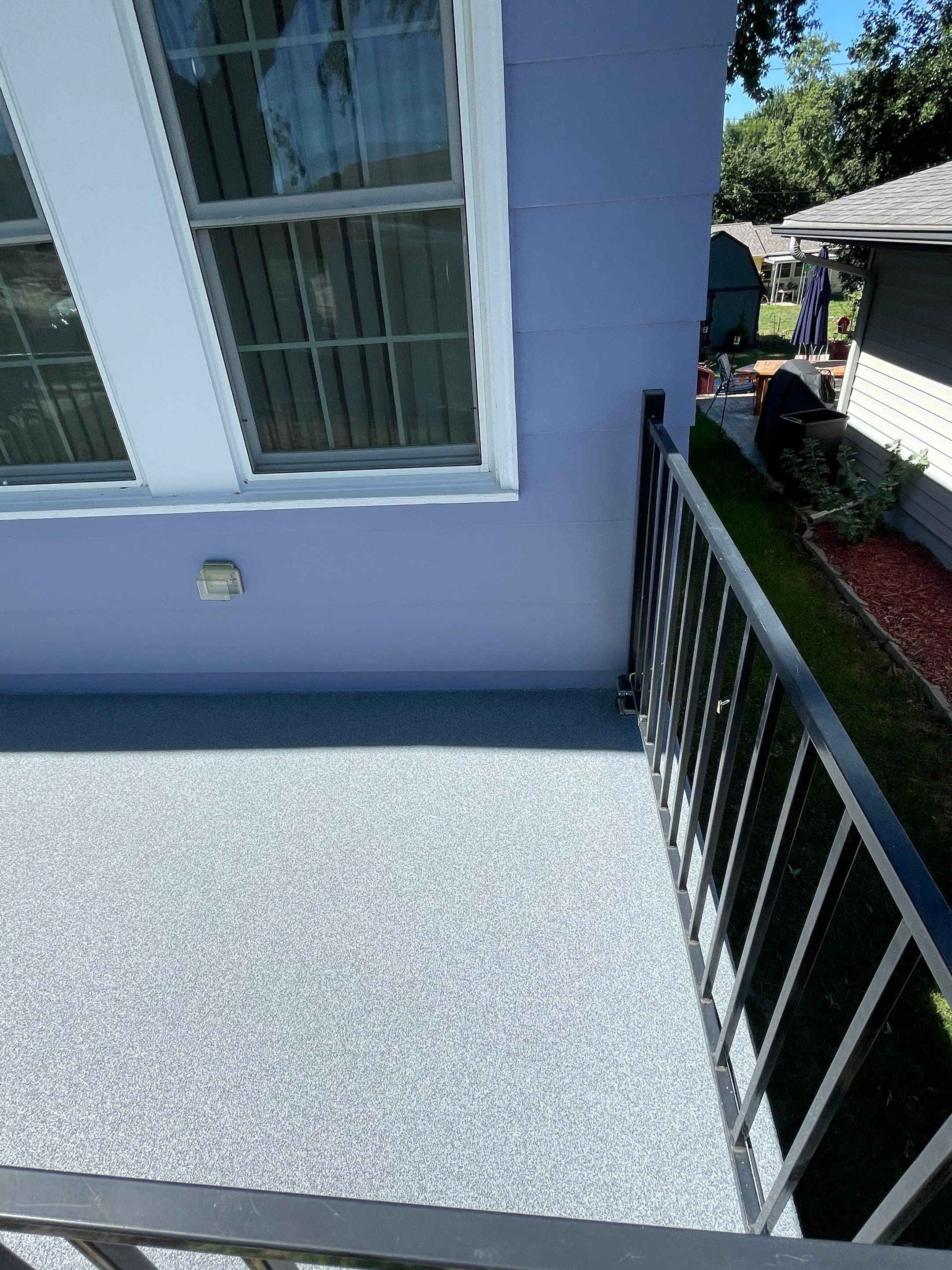 Sioux Falls Concrete Porch Coating with Starry Evening Finish by Select Painting, Coatings & Garage Cabinets