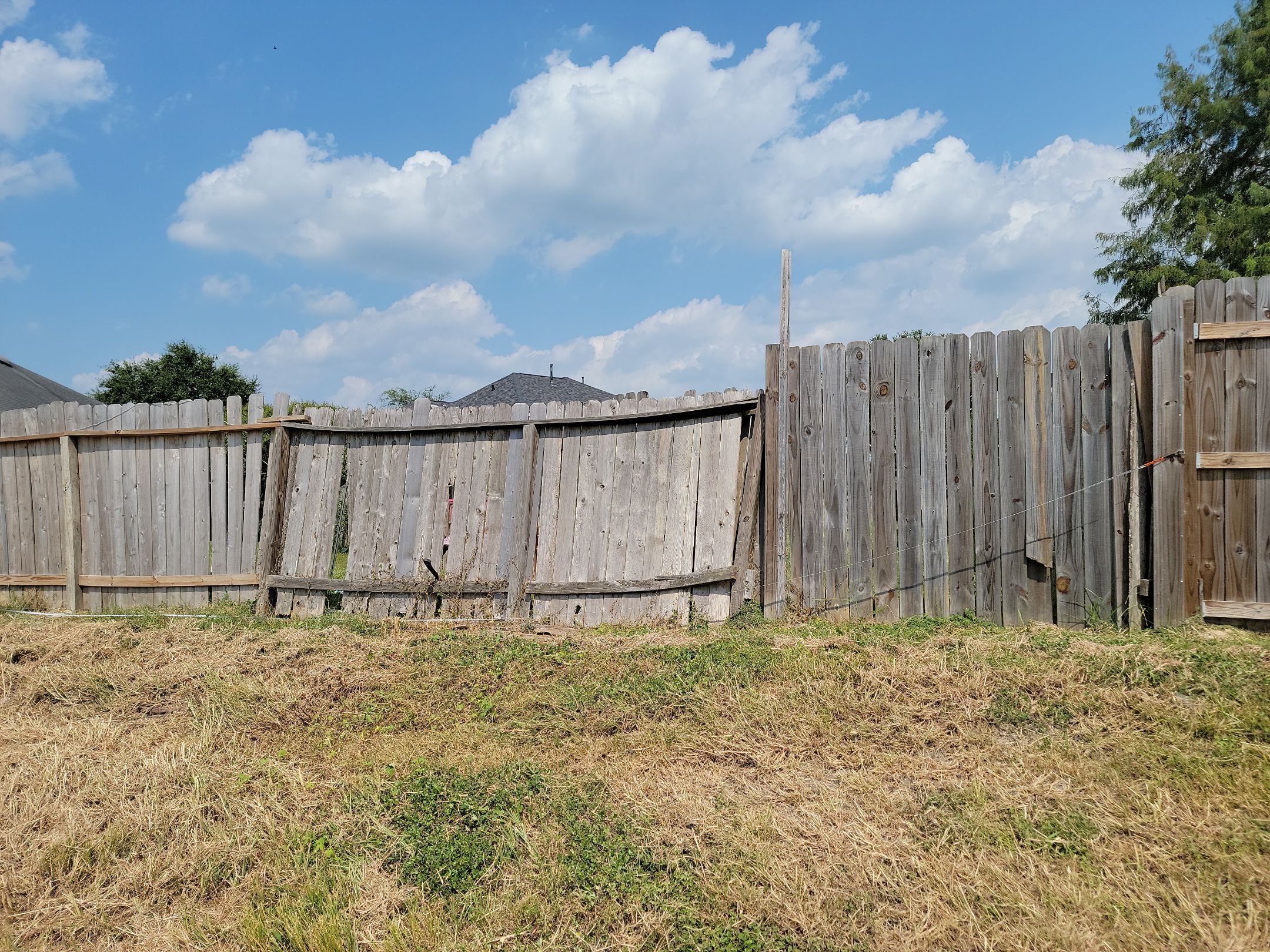 Beautiful Wood fence with metal posts by Tim's Fences
