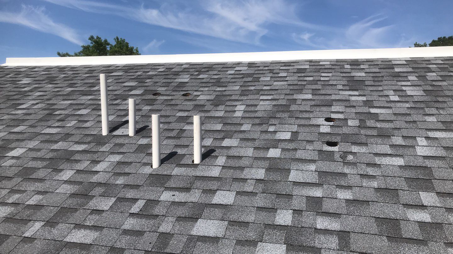 Commercial Roofing Installation using EPDM with white gutters by A Plus Exterior